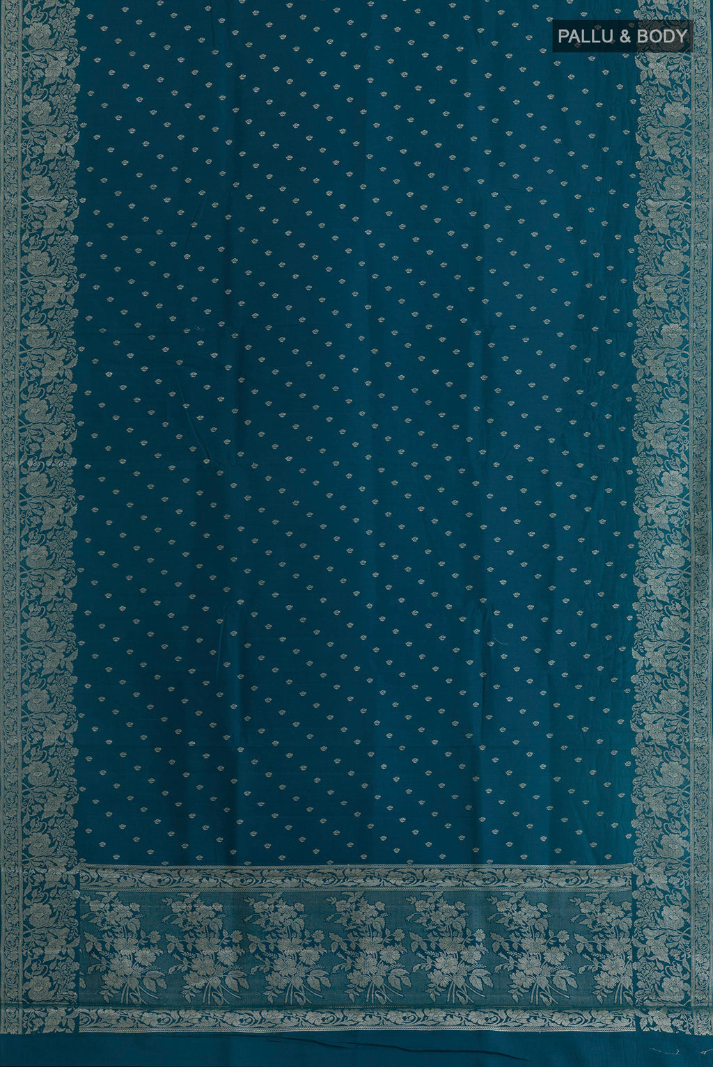 Flat view of Blue Tussar Silk Saree with Zari Butta on the body and Zari Border. 
