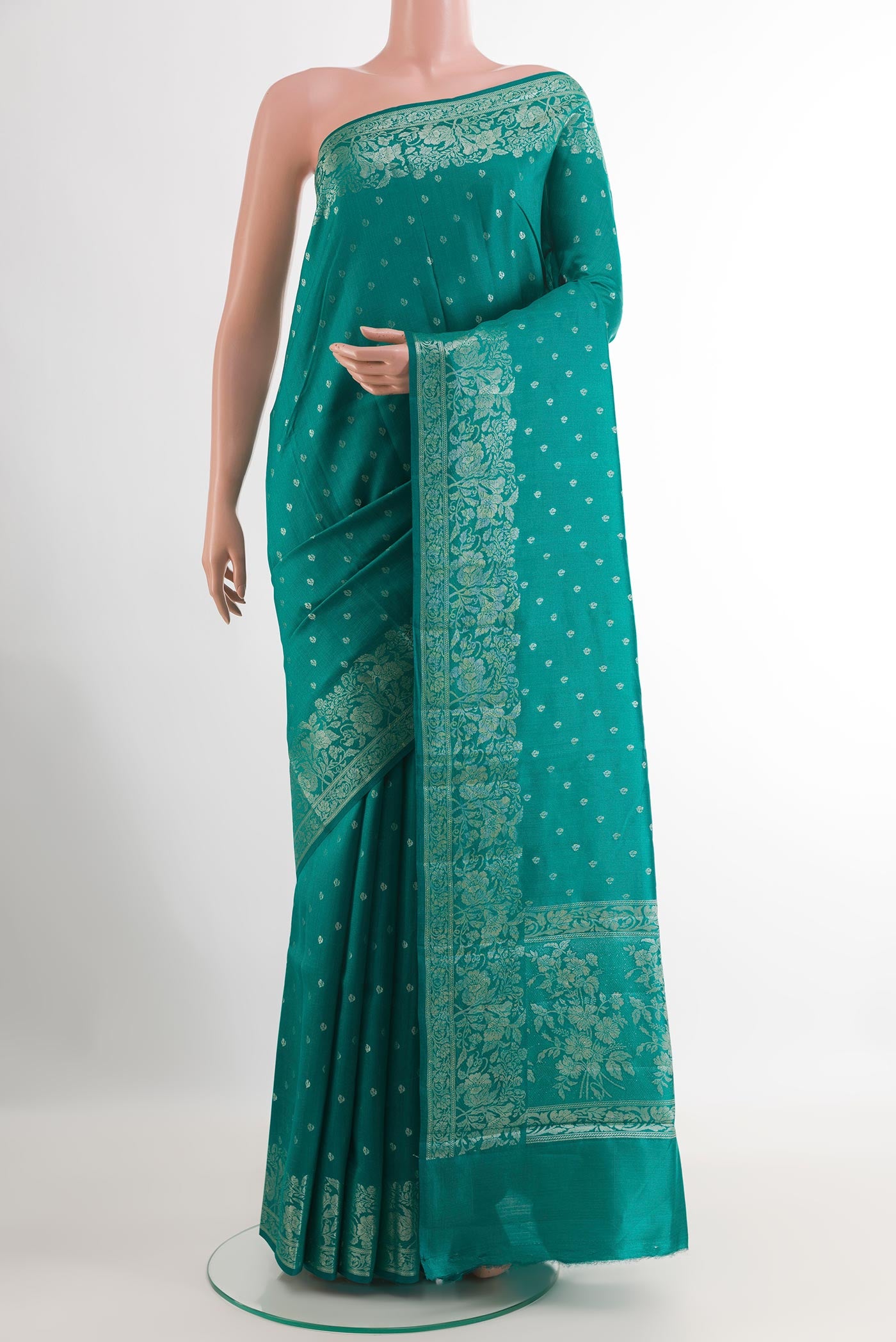 Sea Green Tussar Silk Saree with Zari Butta on the body and Zari Border.  displayed on a mannequin