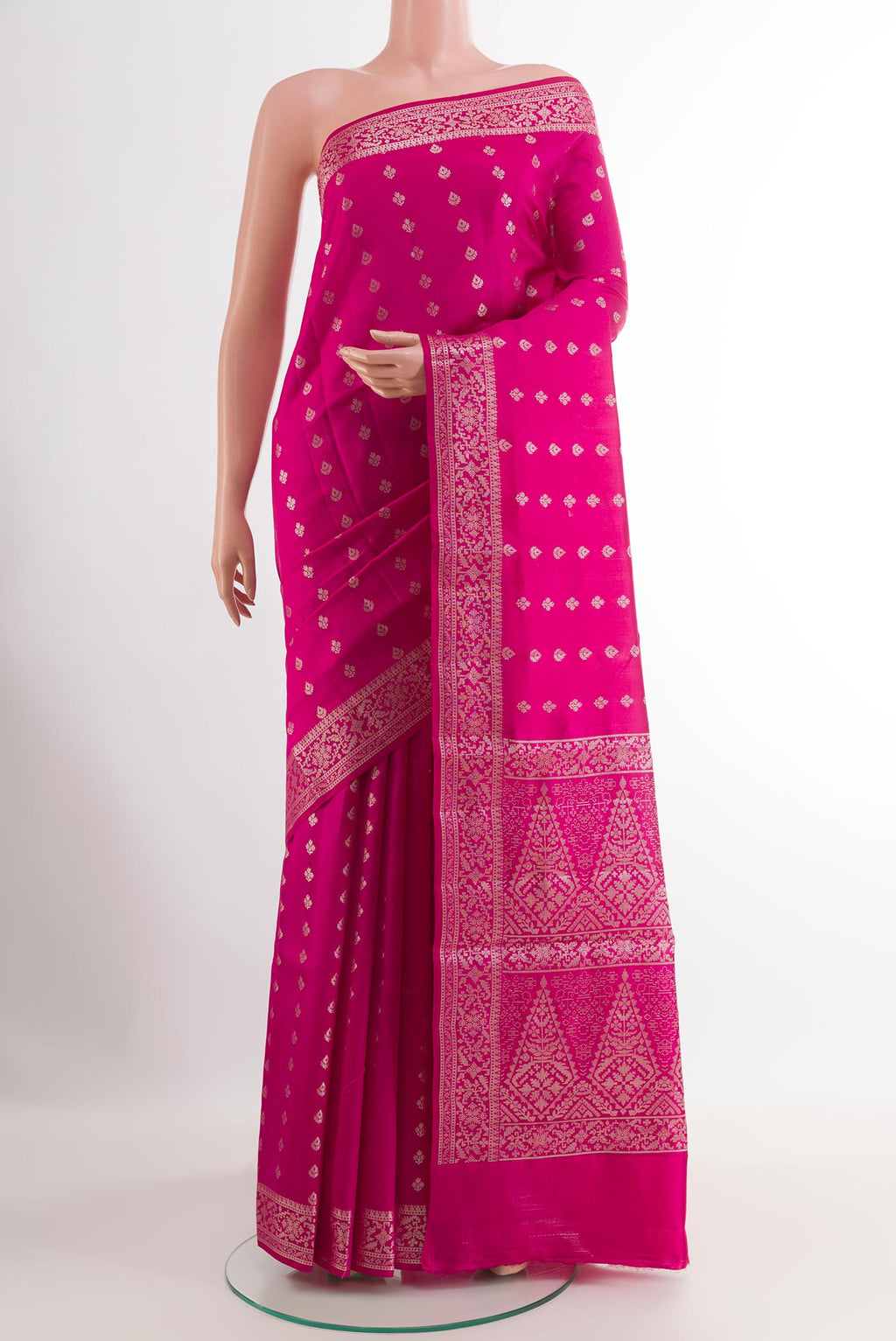 Pink Tussar Silk Saree with Zari Butta on the body and Zari Border.  displayed on a mannequin