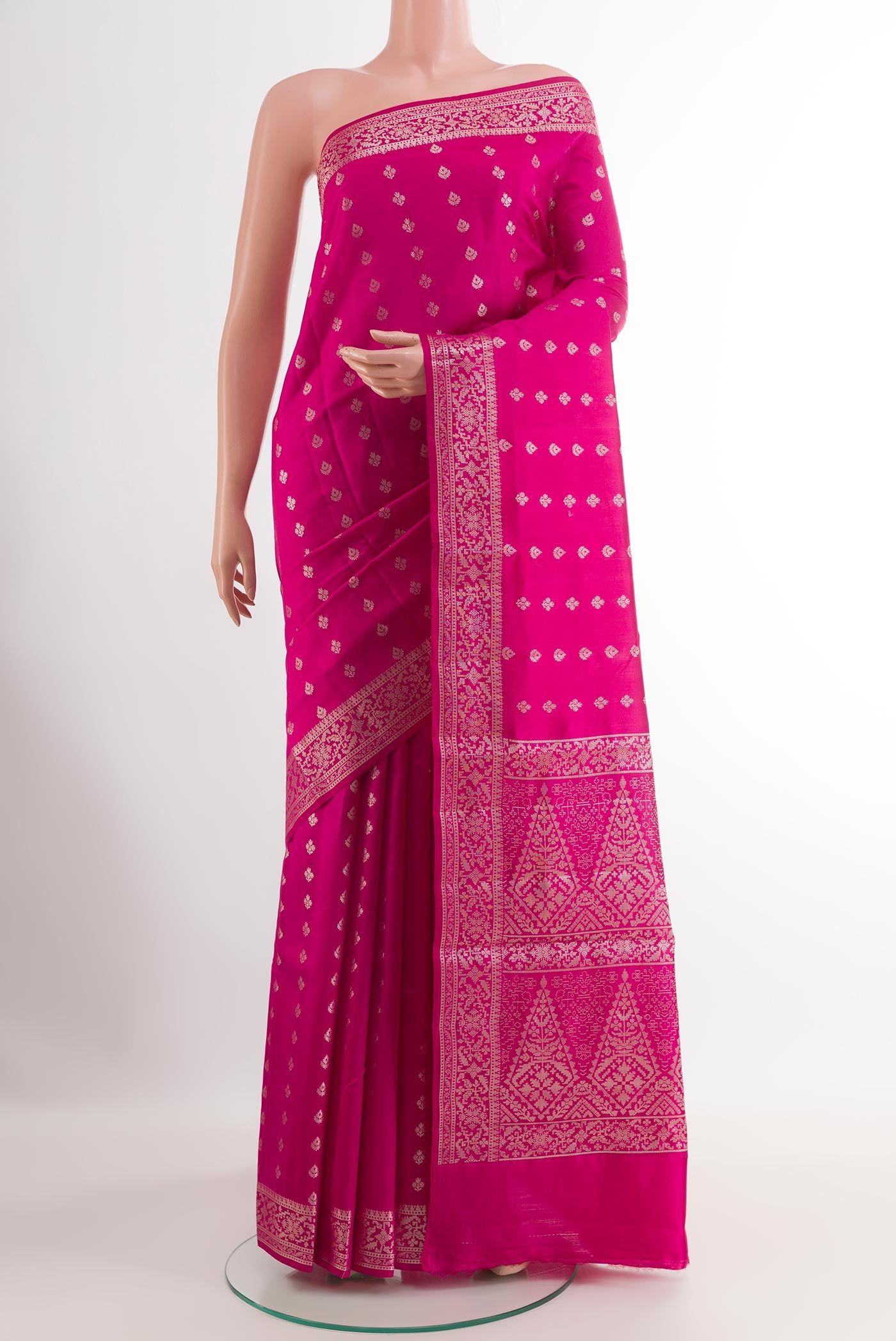 Pink Tussar Silk Saree with Zari Butta on the body and Zari Border.  displayed on a mannequin