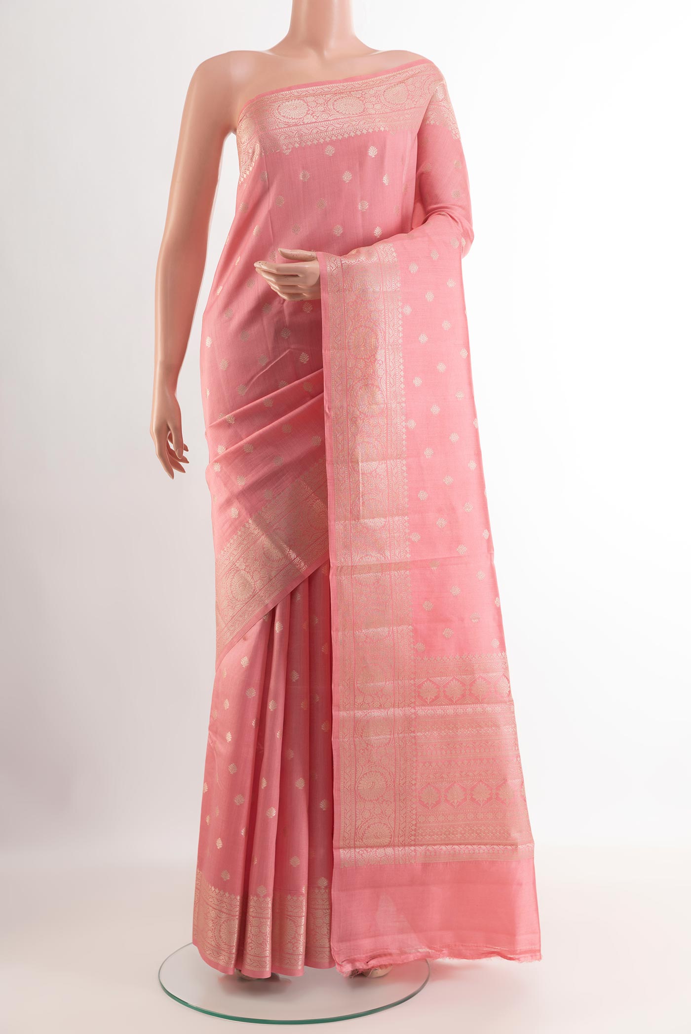 Pink Tussar Silk Saree with Zari Butta on the body and Zari Border.  displayed on a mannequin