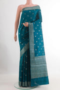 Blue Tussar Silk Saree with Zari Butta on the body and Zari Border.  displayed on a mannequin