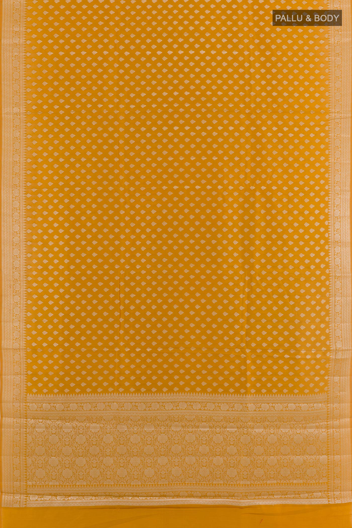Flat view of Yellow Tussar Silk Saree with Zari Butta on the body and Zari Border. 