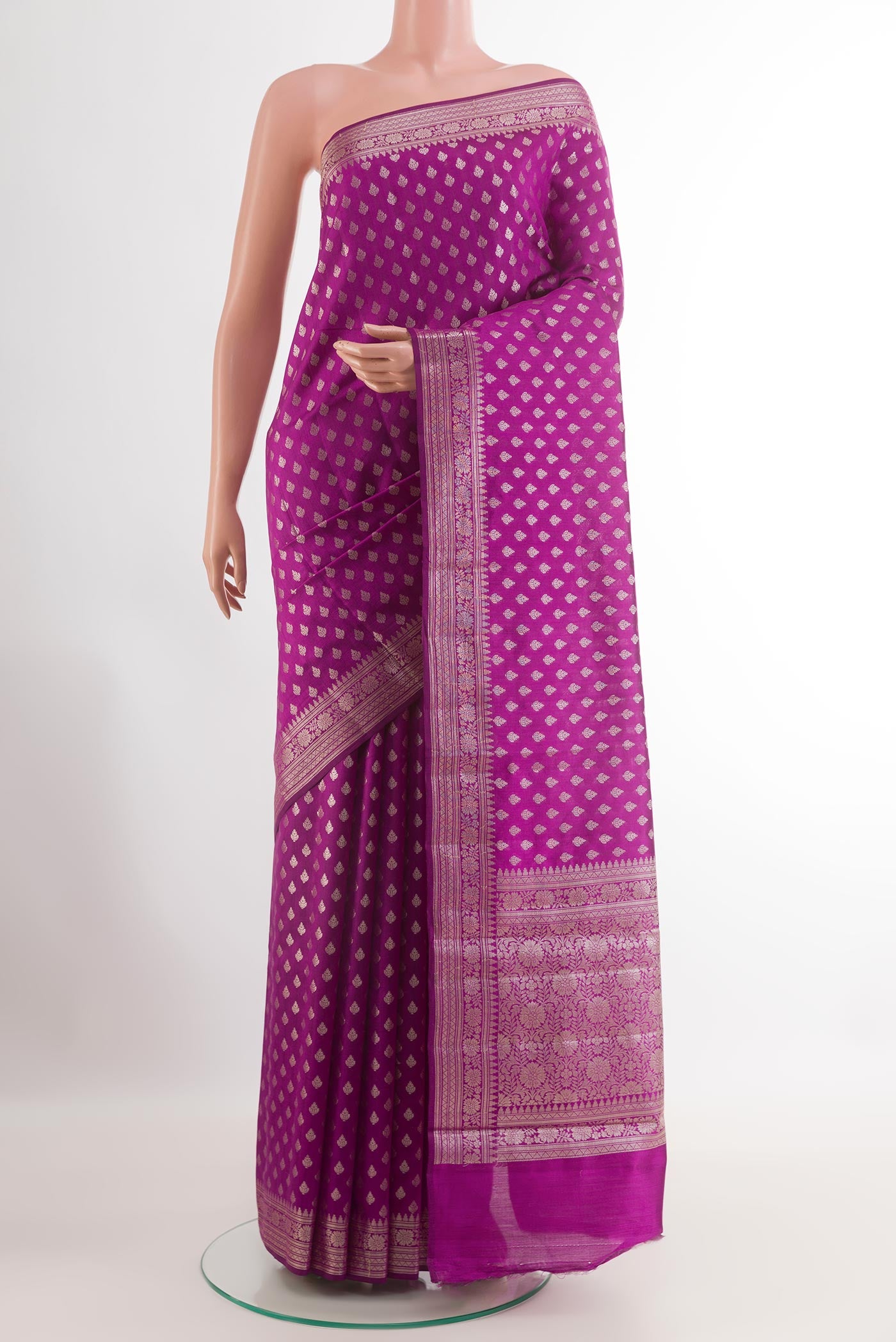 Purple Tussar Silk Saree with Zari Butta on the body and Zari Border.  displayed on a mannequin