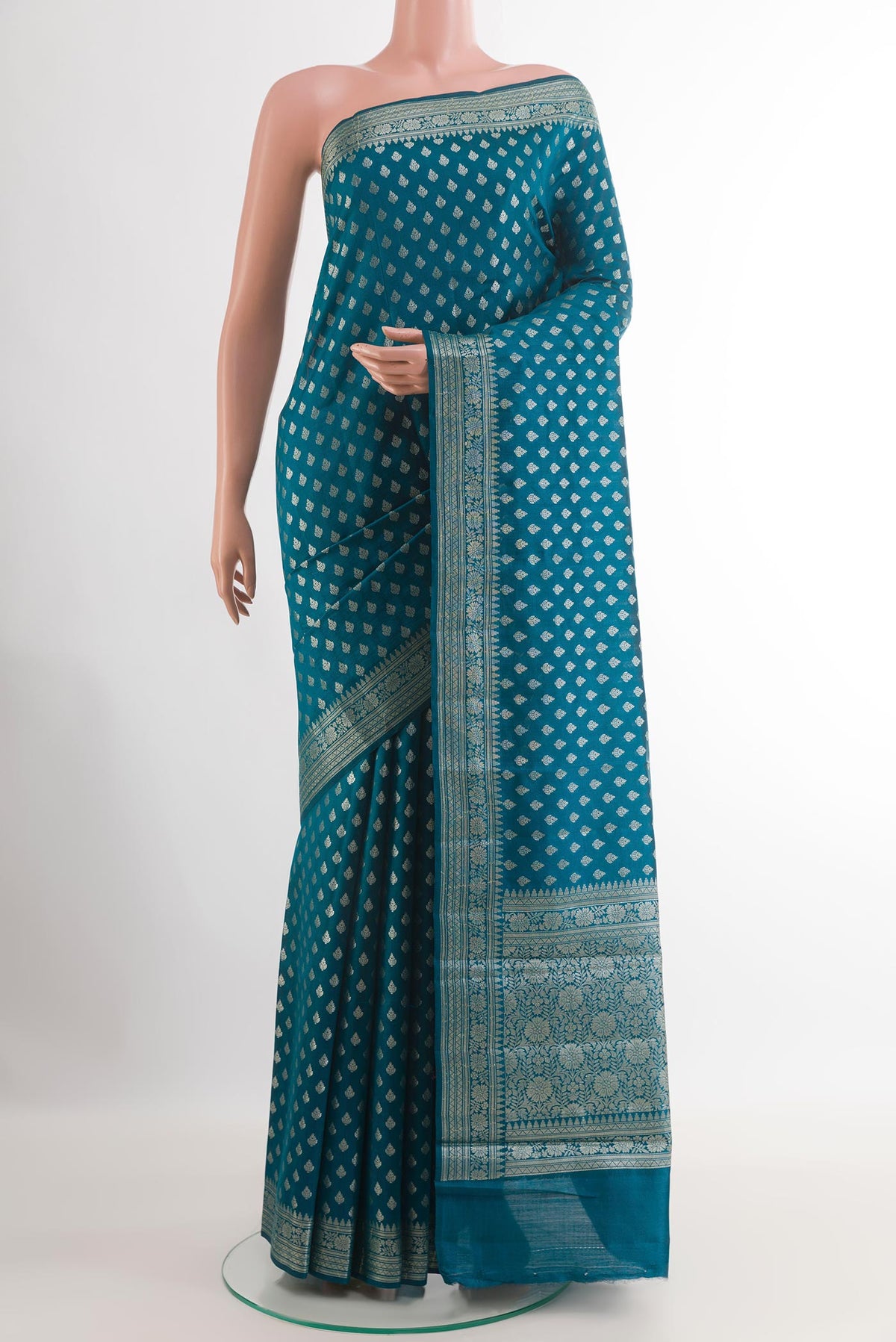 Blue Tussar Silk Saree with Zari Butta on the body and Zari Border.  displayed on a mannequin