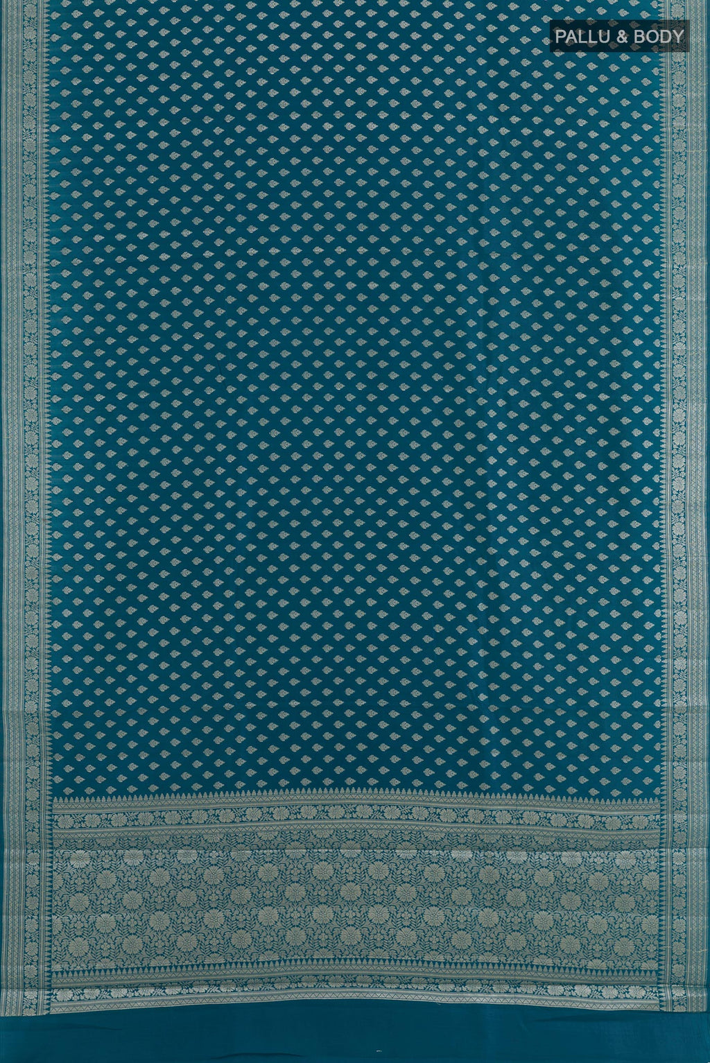 Flat view of Blue Tussar Silk Saree with Zari Butta on the body and Zari Border. 