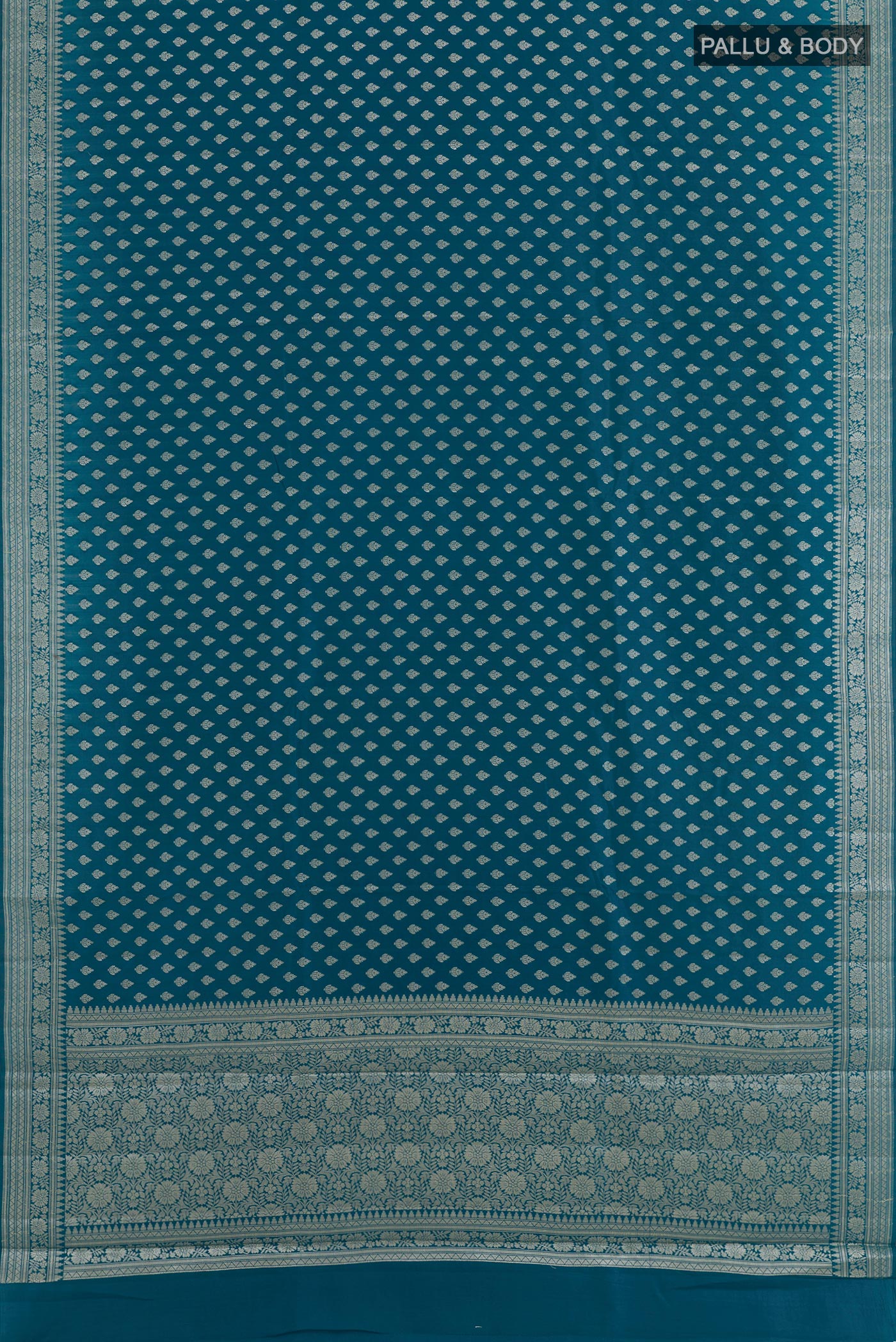 Flat view of Blue Tussar Silk Saree with Zari Butta on the body and Zari Border. 