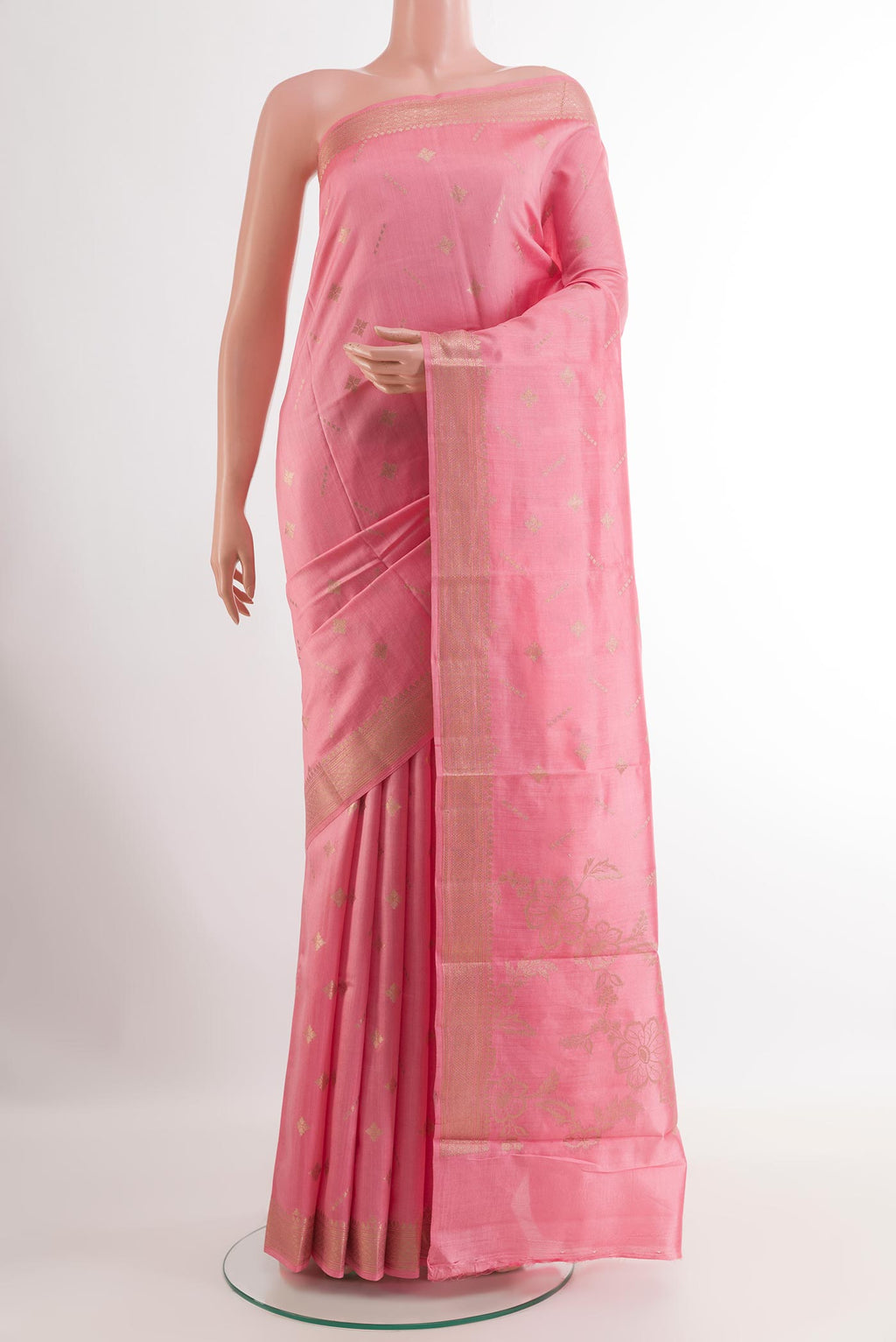 Pink Tussar Silk Saree with Zari Butta on the body and Zari Border.  displayed on a mannequin