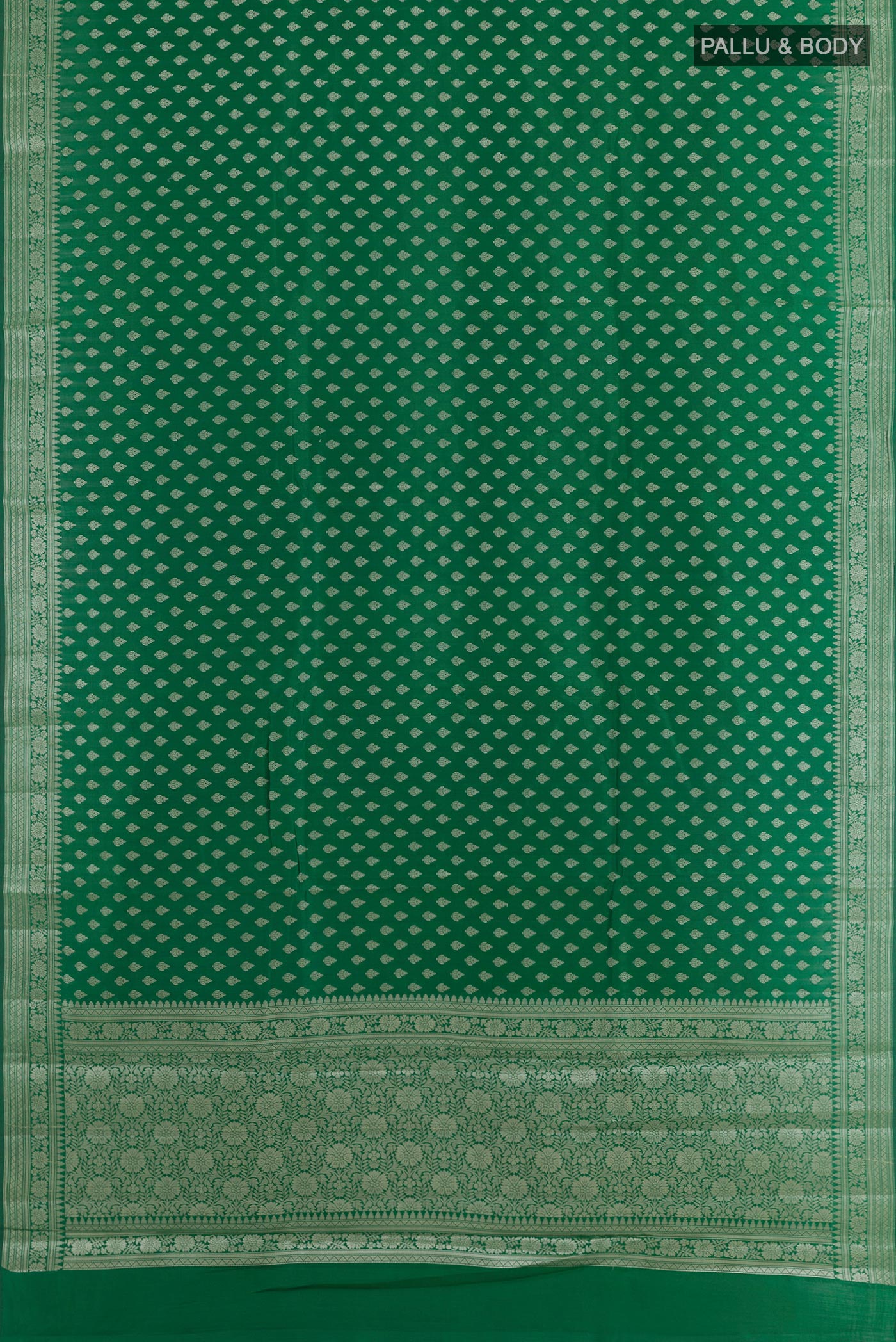 Flat view of Green Tussar Silk Saree with Zari Butta on the body and Zari Border. 
