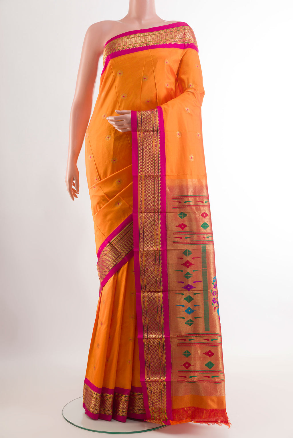 Orange Gadwal Silk Saree with Zari Butta on the body and Zari Border.  displayed on a mannequin