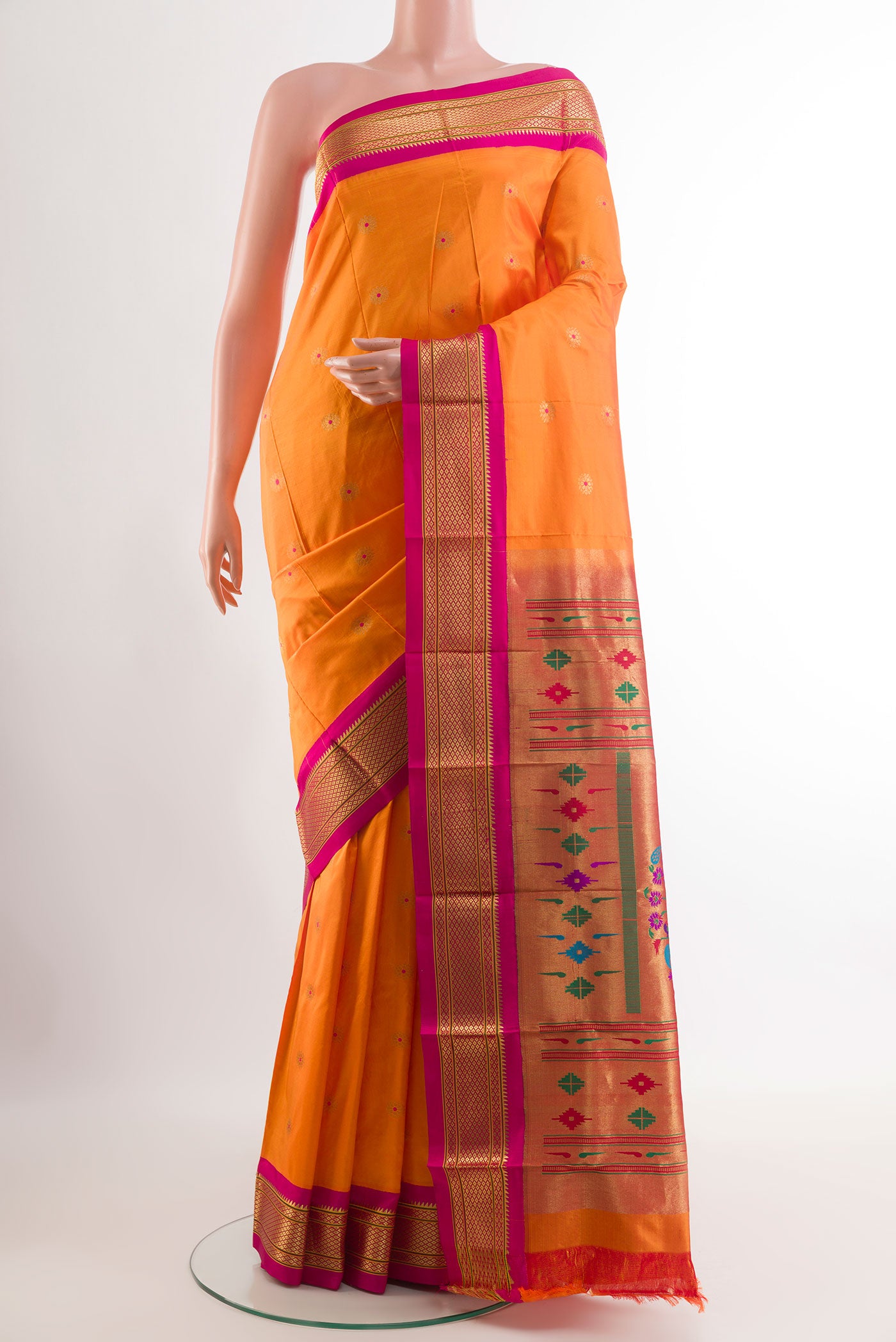 Orange Gadwal Silk Saree with Zari Butta on the body and Zari Border.  displayed on a mannequin