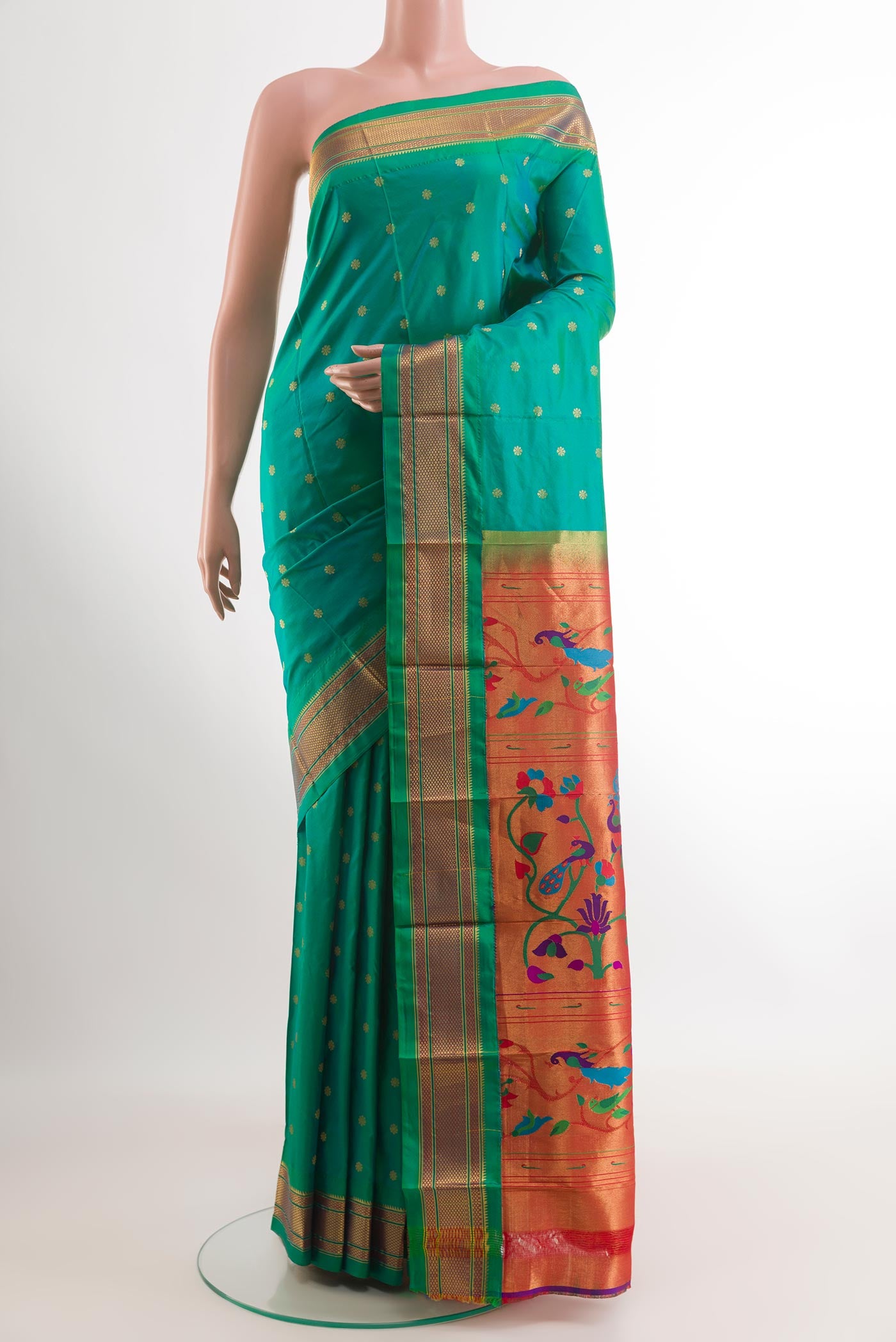 Sea Green Gadwal Silk Saree with Zari Butta on the body and Zari Border.  displayed on a mannequin