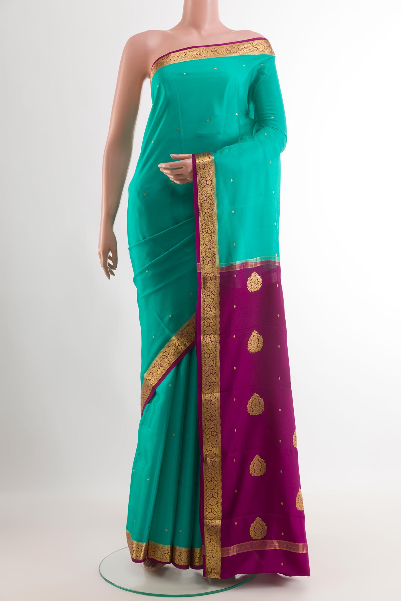 Sea Green Mysore Silk Saree with Zari Butta on the body and Zari Border.  displayed on a mannequin