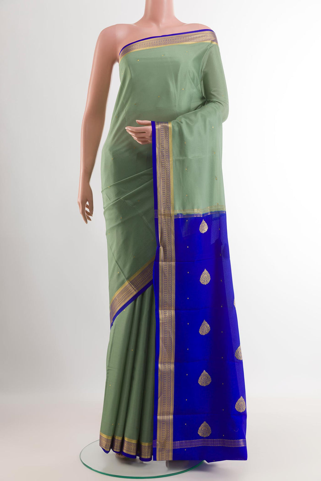 Sage Green Mysore Silk Saree with Zari Butta on the body and Zari Border.  displayed on a mannequin