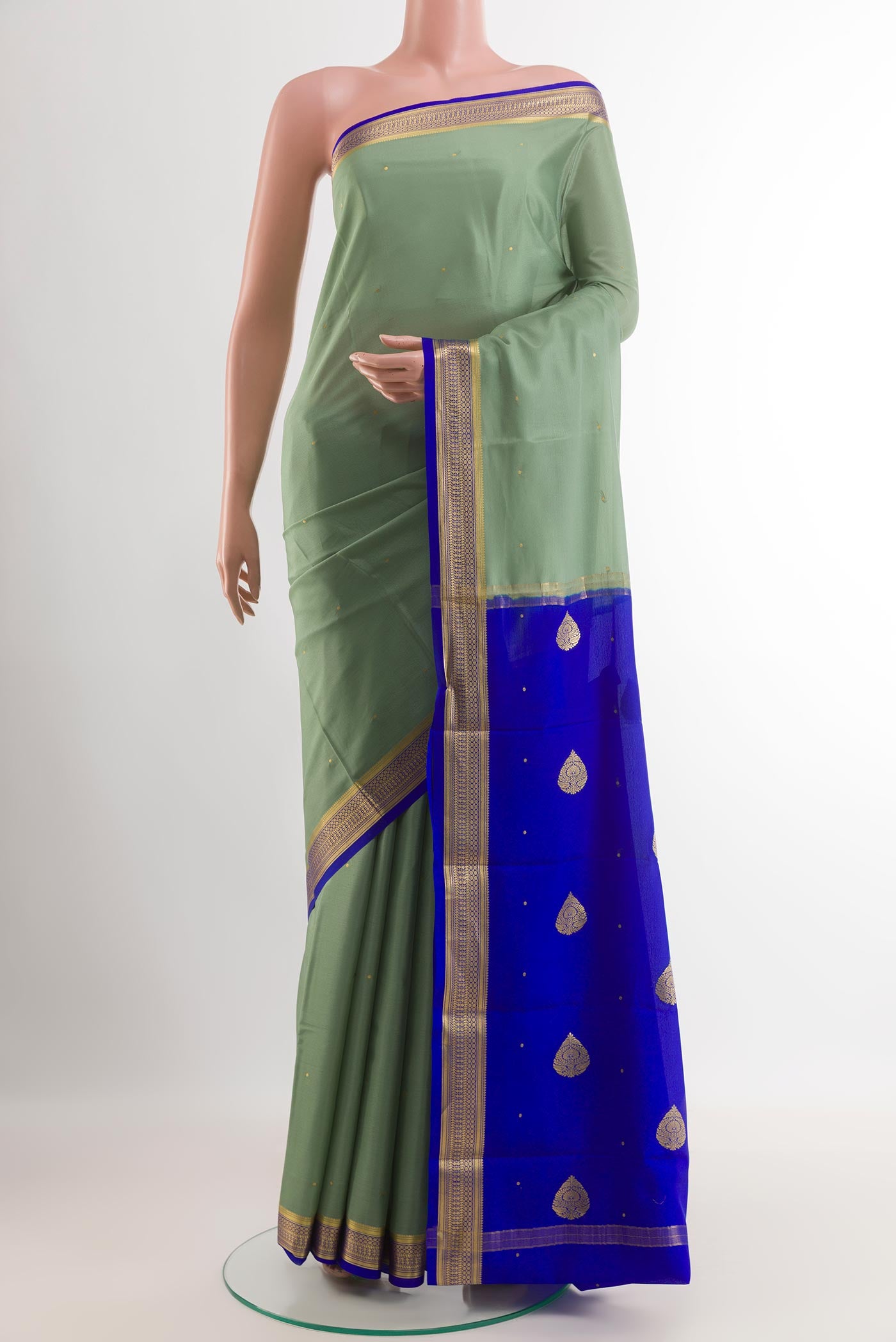 Sage Green Mysore Silk Saree with Zari Butta on the body and Zari Border.  displayed on a mannequin