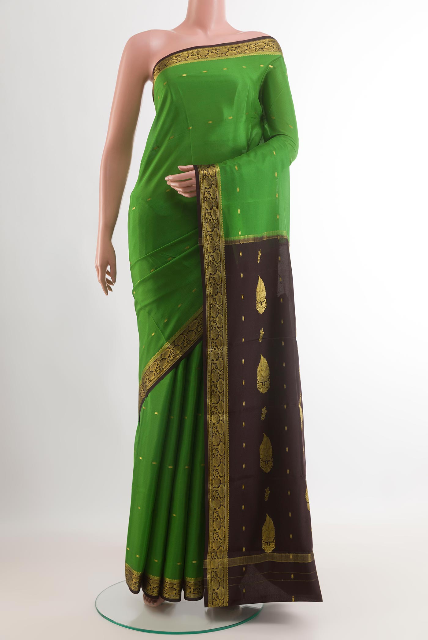 Green Mysore Silk Saree with Zari Butta on the body and Zari Border.  displayed on a mannequin