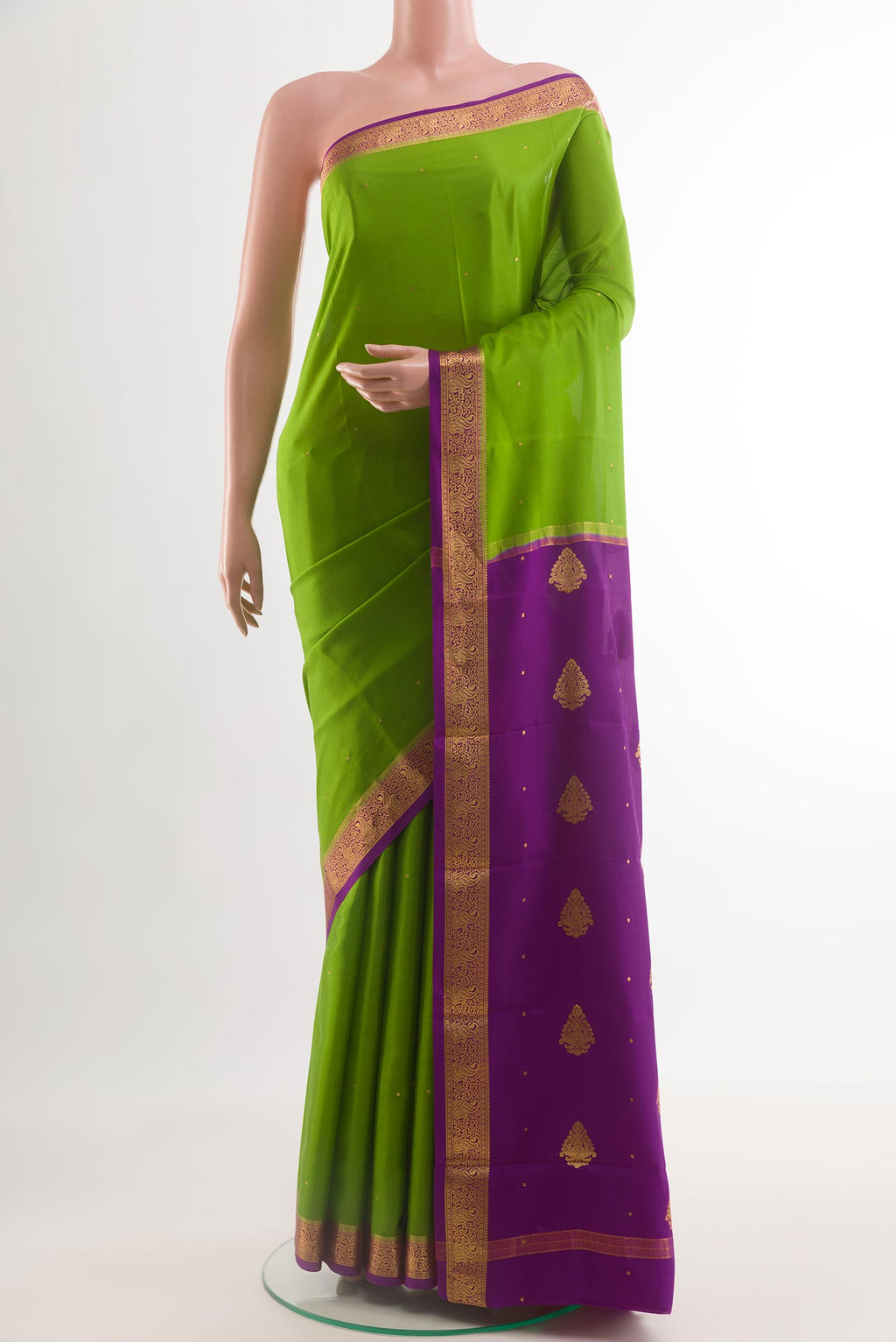 Green Mysore Crepe Saree with Zari Butta on the body and Zari Border.  displayed on a mannequin