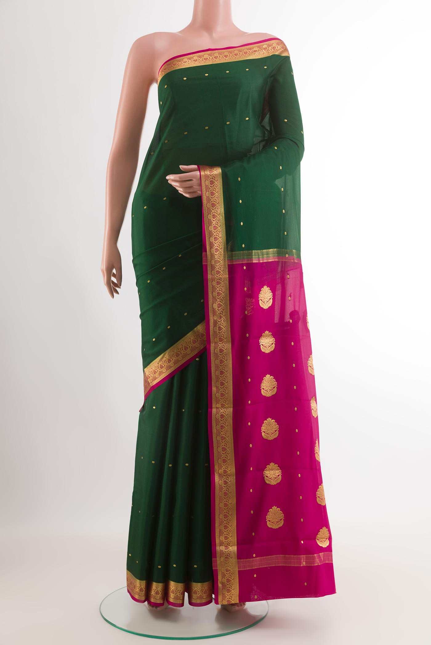 Green Mysore Silk Saree with Zari Butta on the body and Zari Border.  displayed on a mannequin