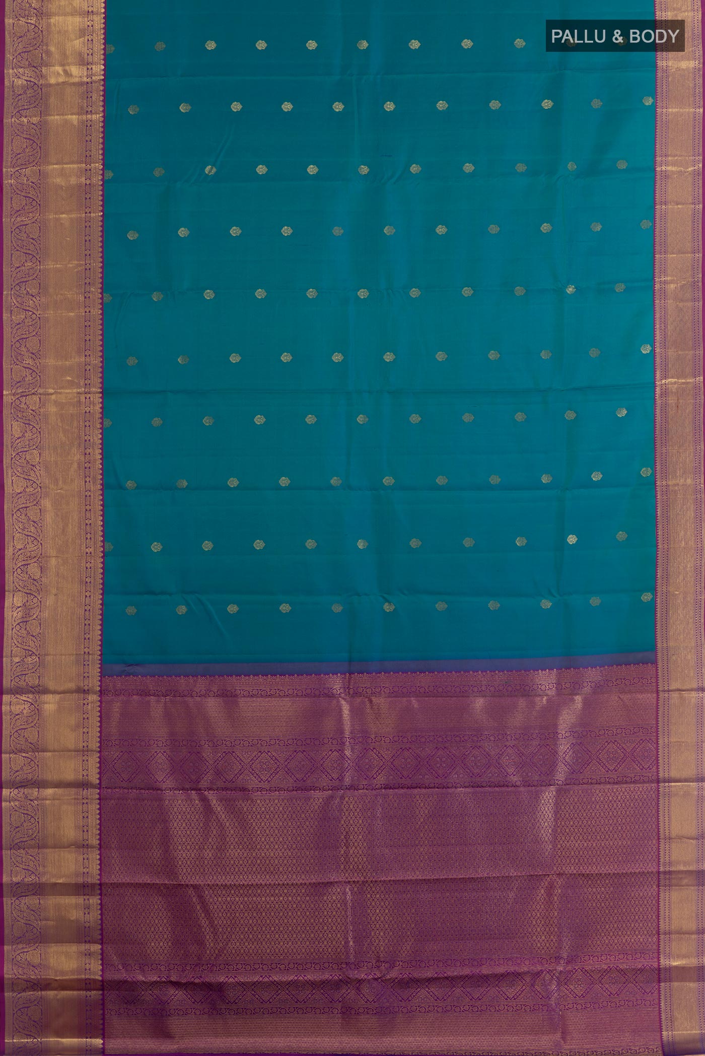 Flat view of Peacock Blue Kanchipuram Silk Saree with Zari Butta on the body and Zari Border. 