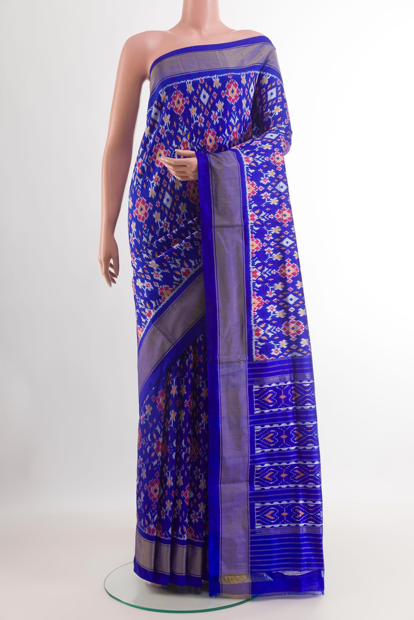 Blue Pochampally Silk Saree with Ikat design on the body and Zari Border.  displayed on a mannequin