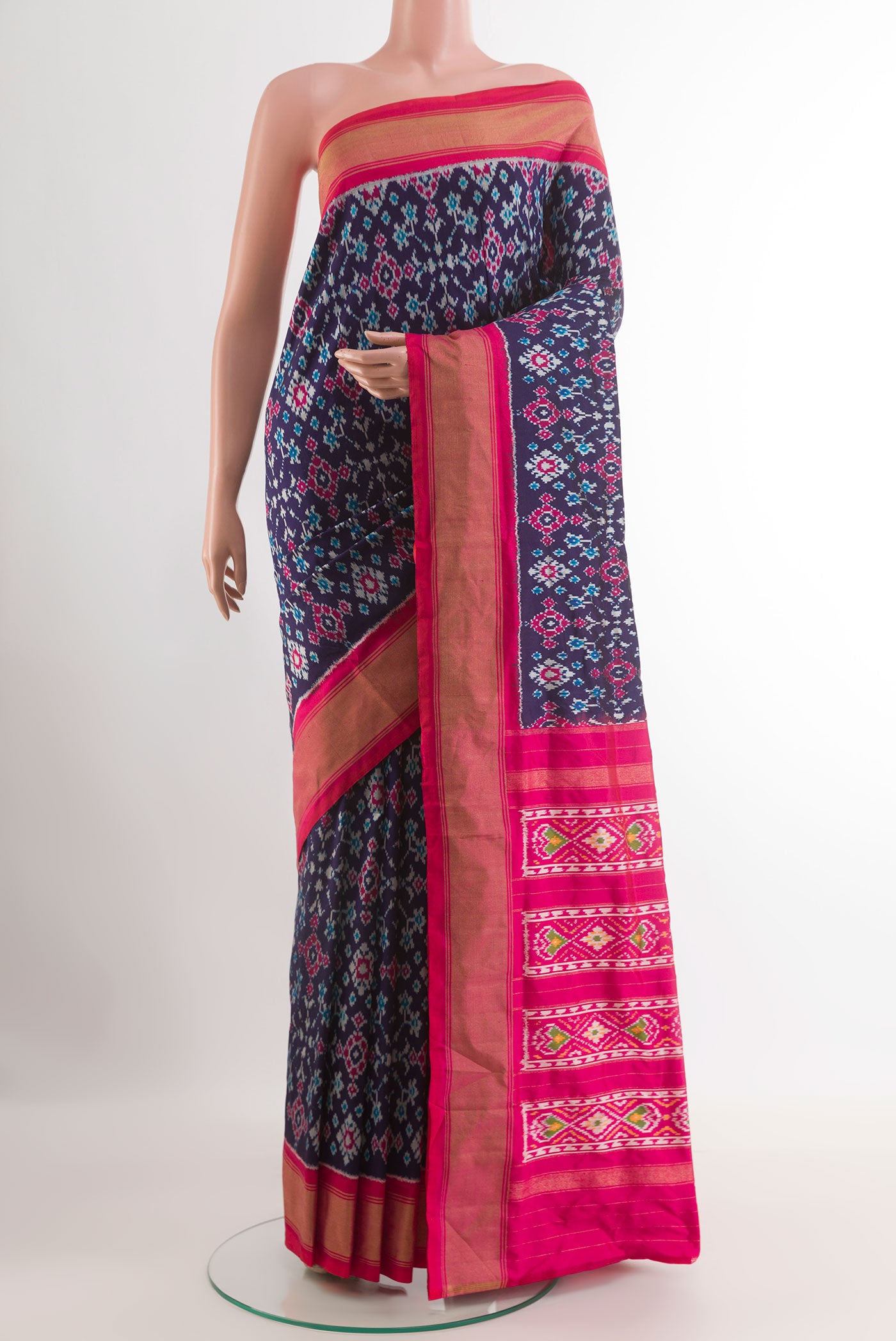 Blue Pochampally Silk Saree with Pure Ikat on the body and Zari Border.  displayed on a mannequin