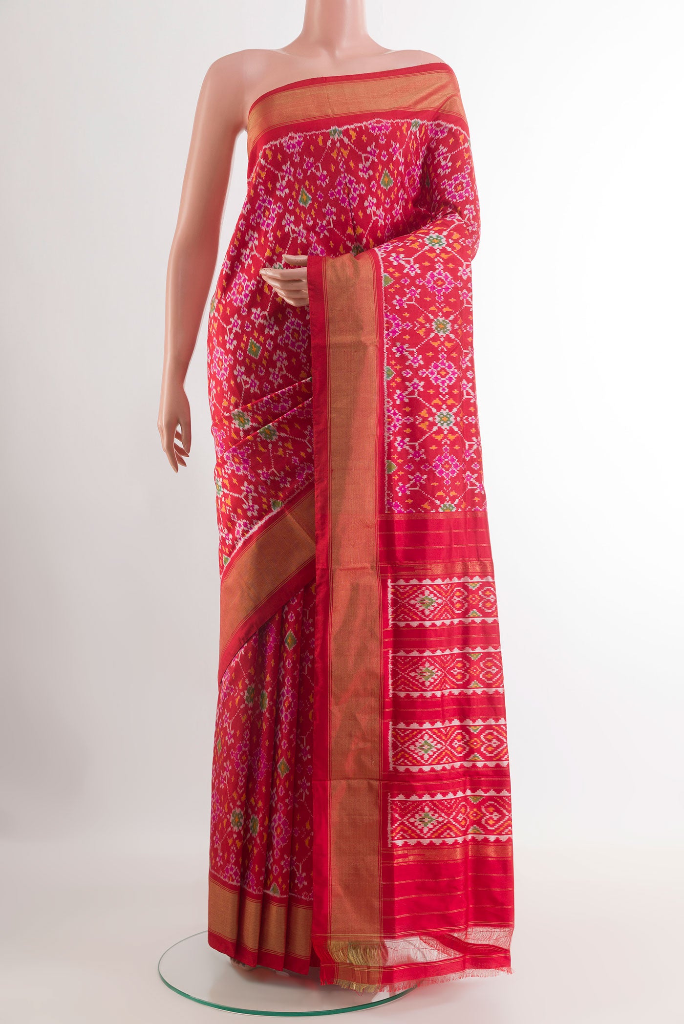 Red Pochampally Silk Saree with Pure Ikat on the body and Zari Border.  displayed on a mannequin