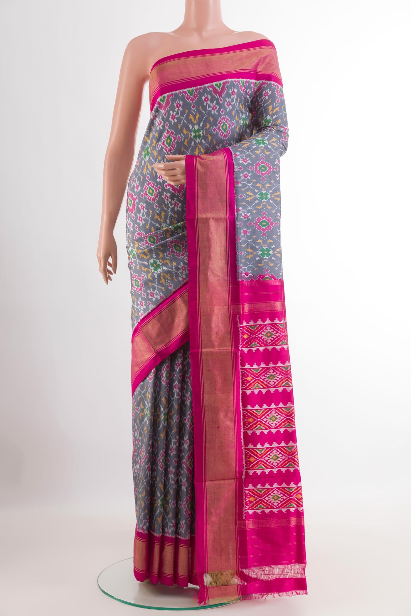 Grey Pochampally Silk Saree with Pure Ikat on the body and Zari Border.  displayed on a mannequin