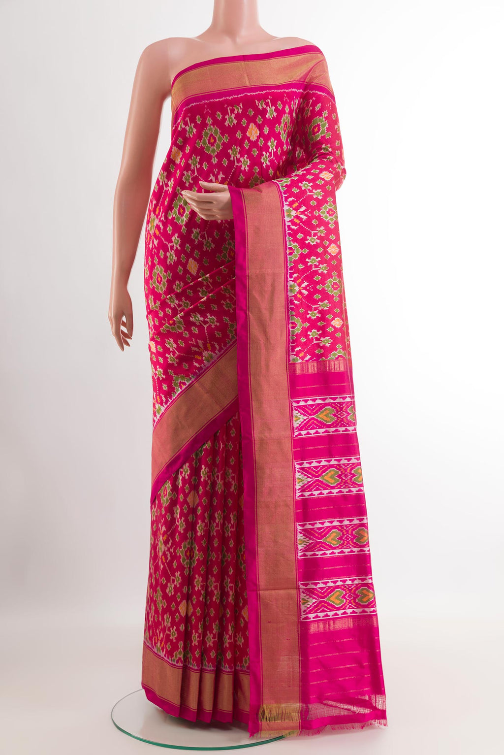 Pink Pochampally Silk Saree with Ikat design on the body and Zari Border.  displayed on a mannequin