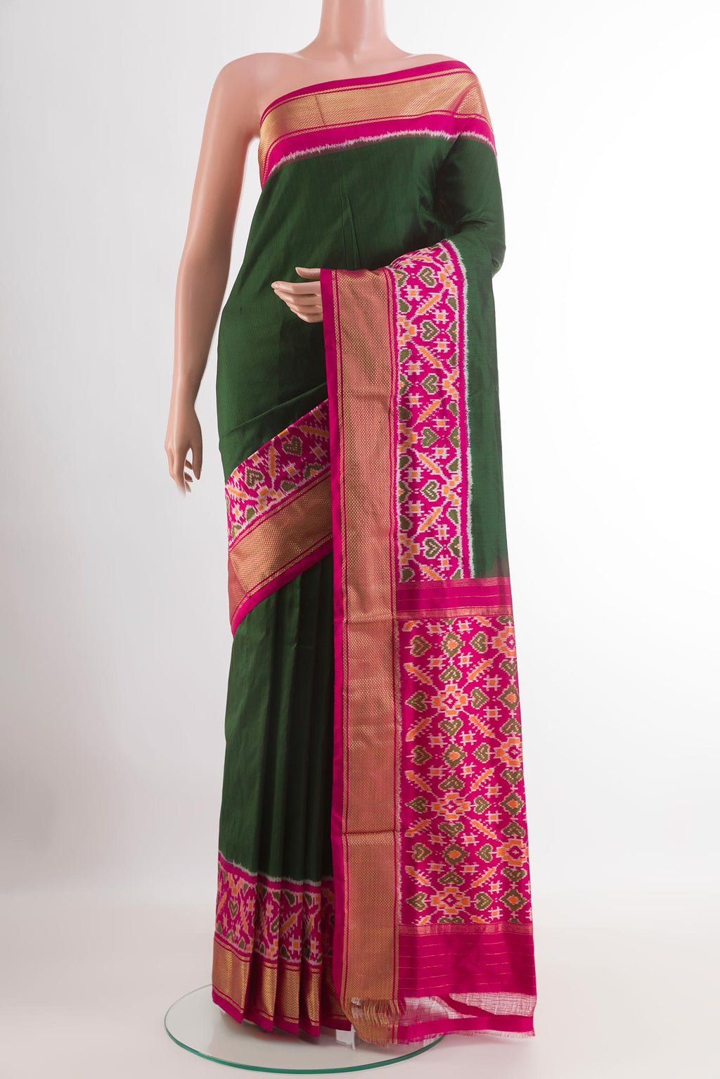 Green Pochampally Silk Saree with Pure Ikat on the body and Zari Border.  displayed on a mannequin