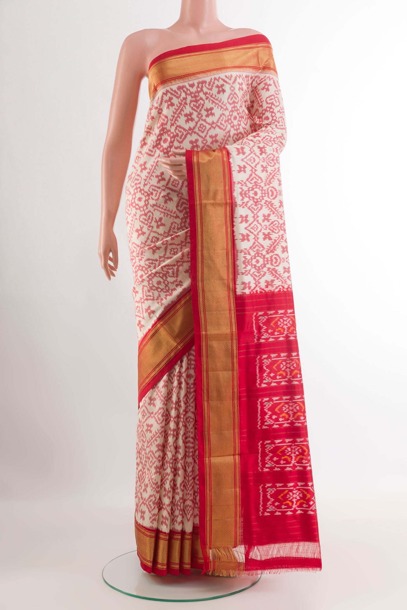 Off White Pochampally Silk Saree with Pure Ikat on the body and Zari Border.  displayed on a mannequin