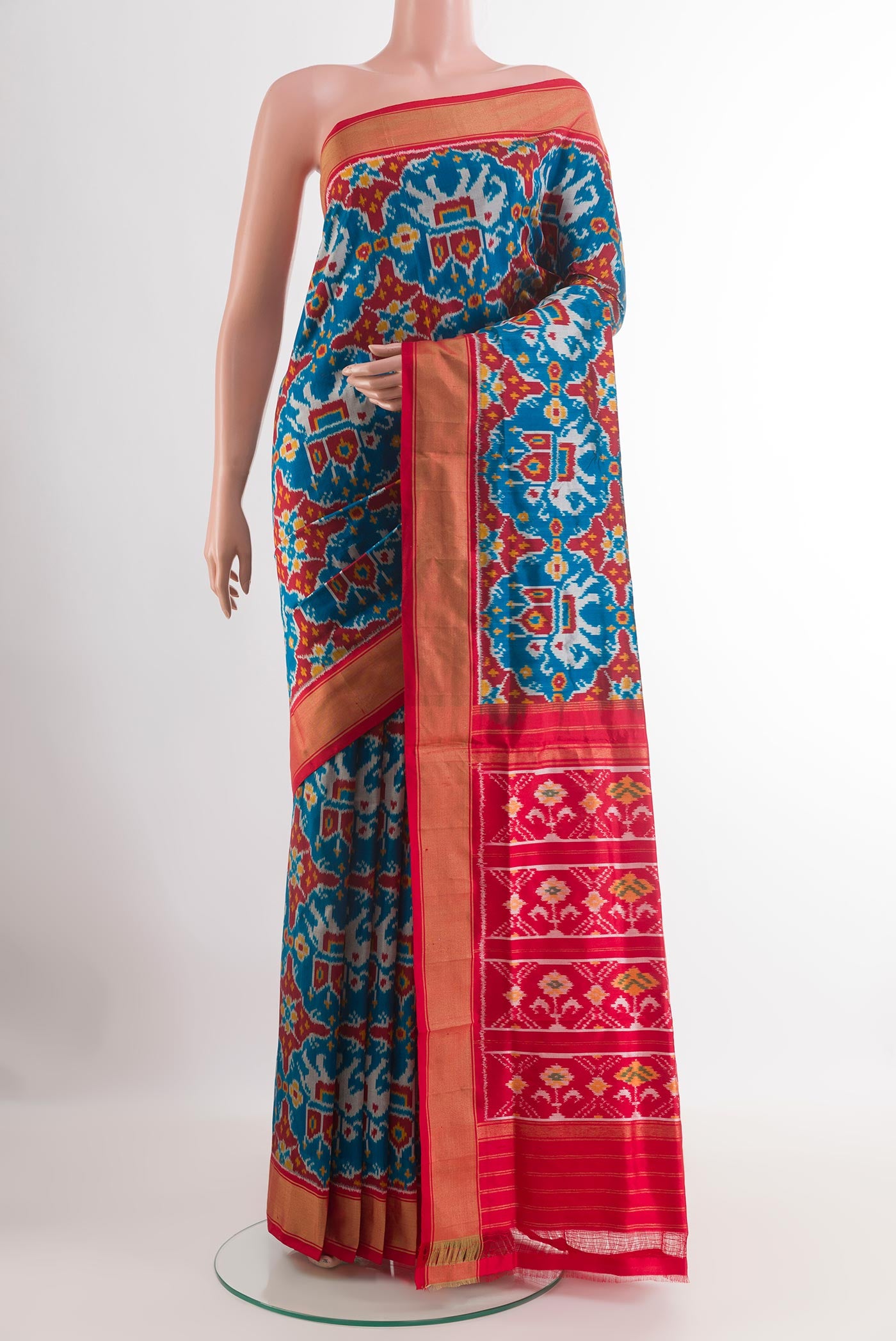 Blue Pochampally Silk Saree with Pure Ikat on the body and Zari Border.  displayed on a mannequin