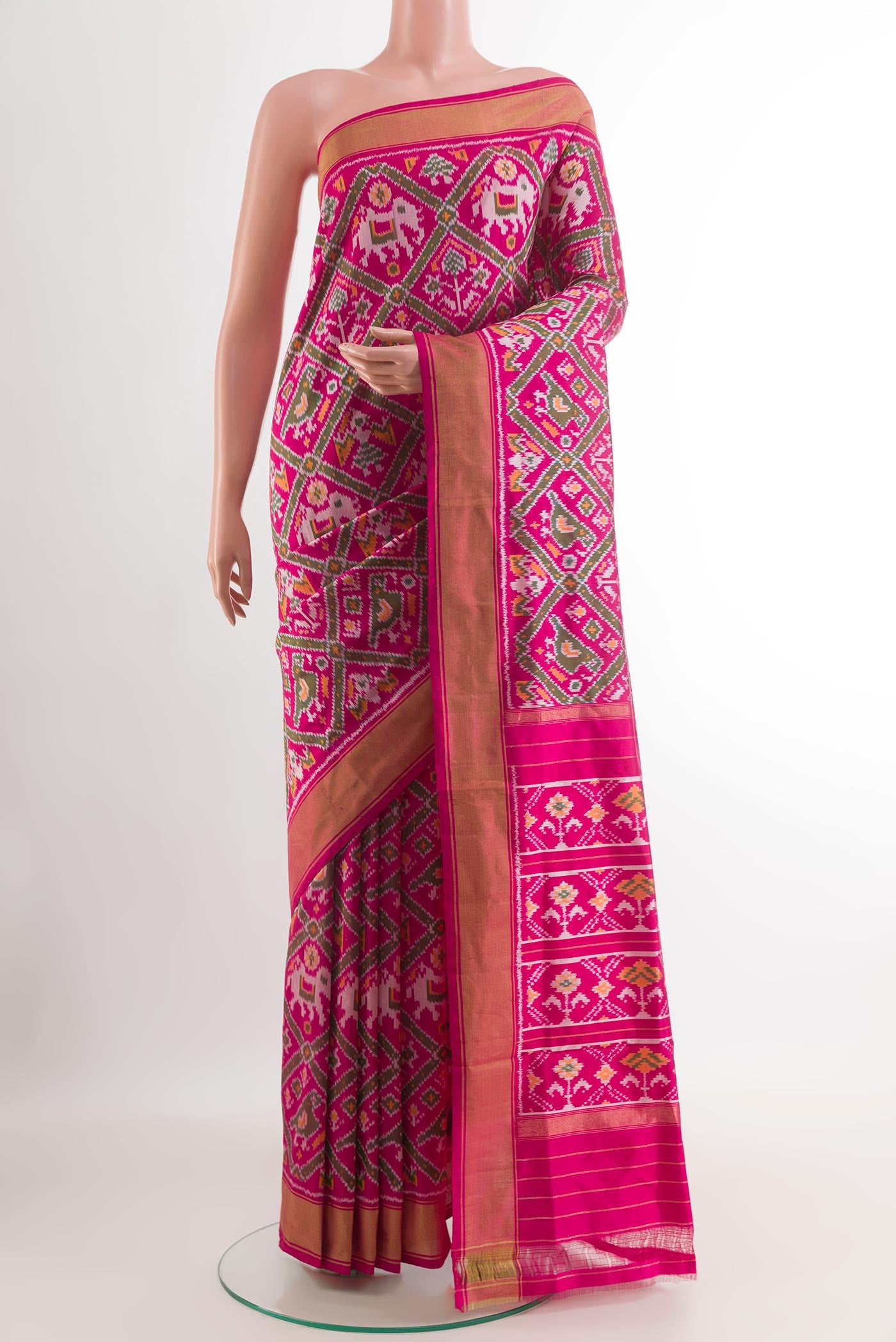 Pink Pochampally Silk Saree with Ikat design on the body and Zari Border.  displayed on a mannequin