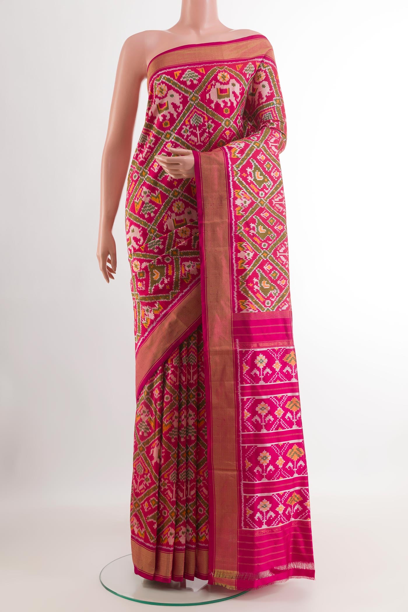 Pink Pochampally Silk Saree with Ikat design on the body and Zari Border.  displayed on a mannequin