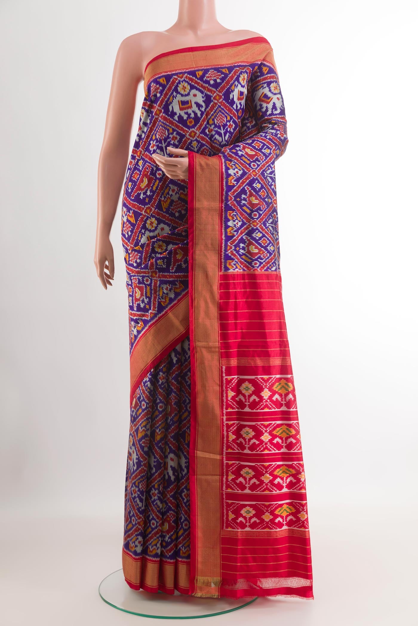 Blue Pochampally Silk Saree with Ikat design on the body and Zari Border.  displayed on a mannequin