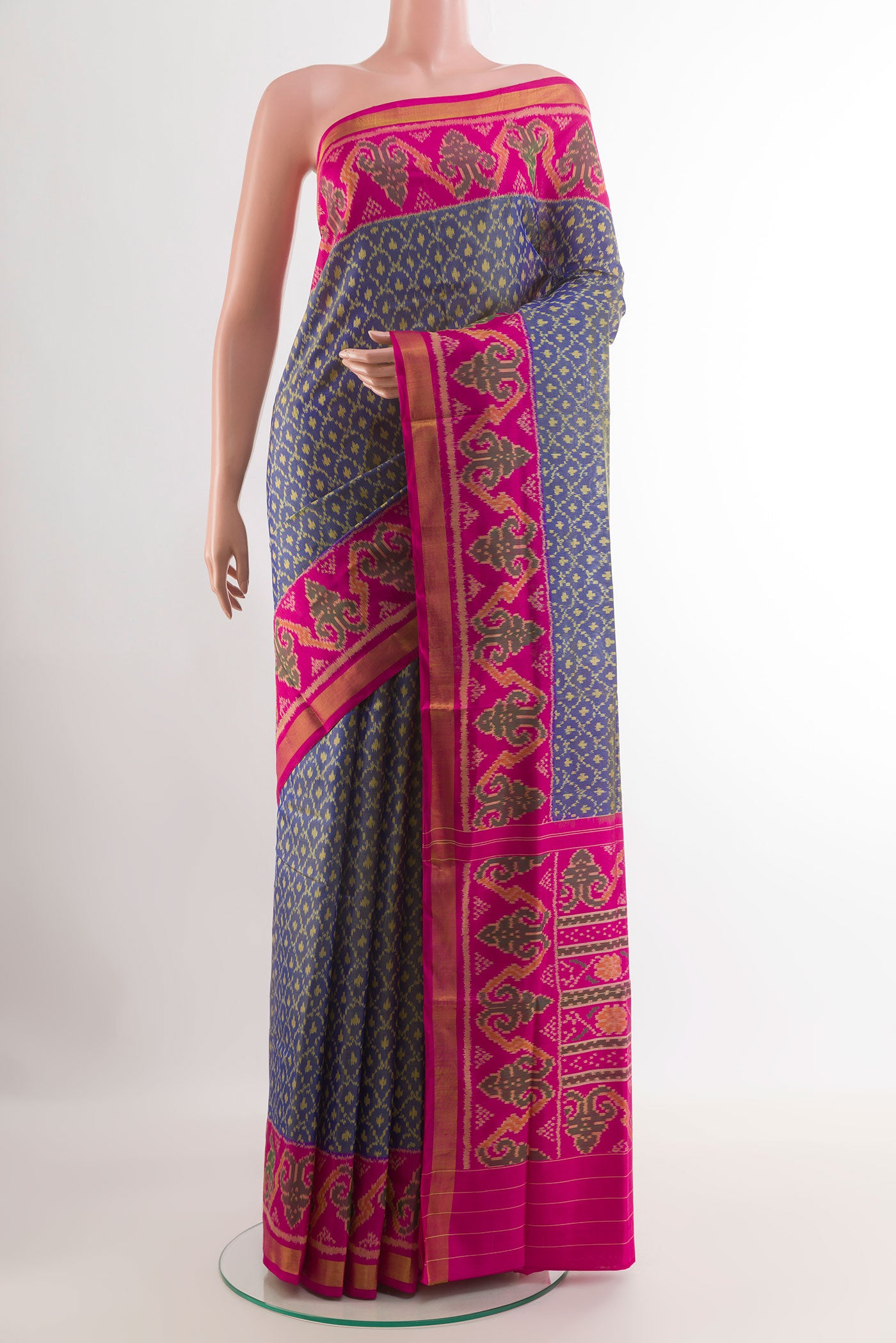 Blue Rajkot Patola Silk Saree with Pure Ikat on the body and Zari Border.  displayed on a mannequin