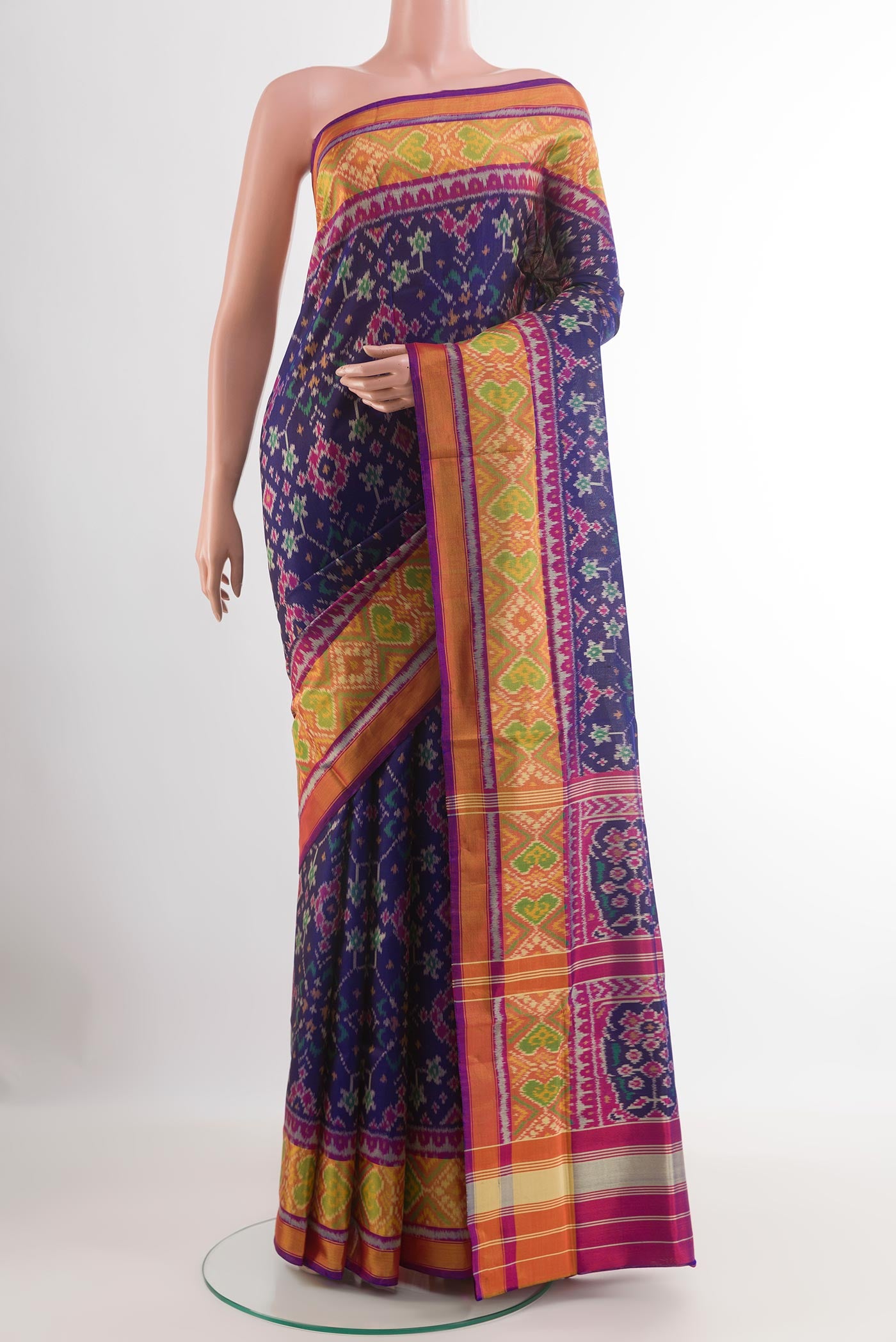 Blue Rajkot Patola Silk Saree with Pure Ikat on the body and Zari Border.  displayed on a mannequin