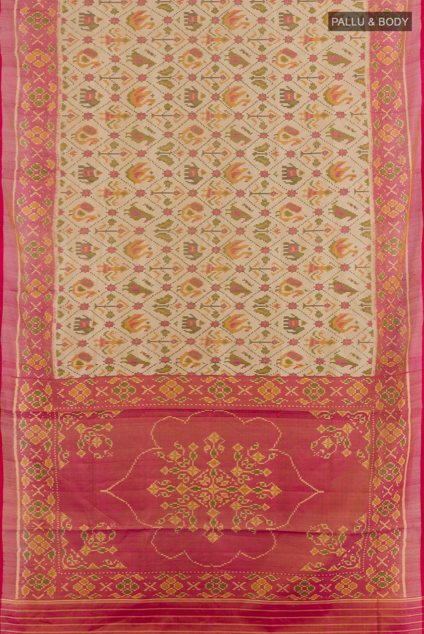 Flat view of Cream Rajkot Patola Silk Saree with Ikat design on the body and Zari Border. 