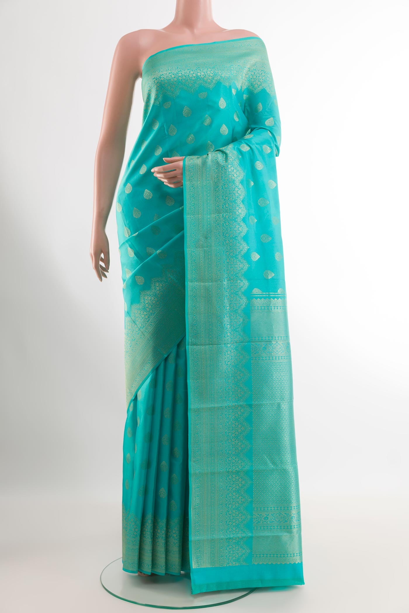 Sea Green Kanchipuram Silk Saree with Zari Brocade on the body and Zari Border.  displayed on a mannequin