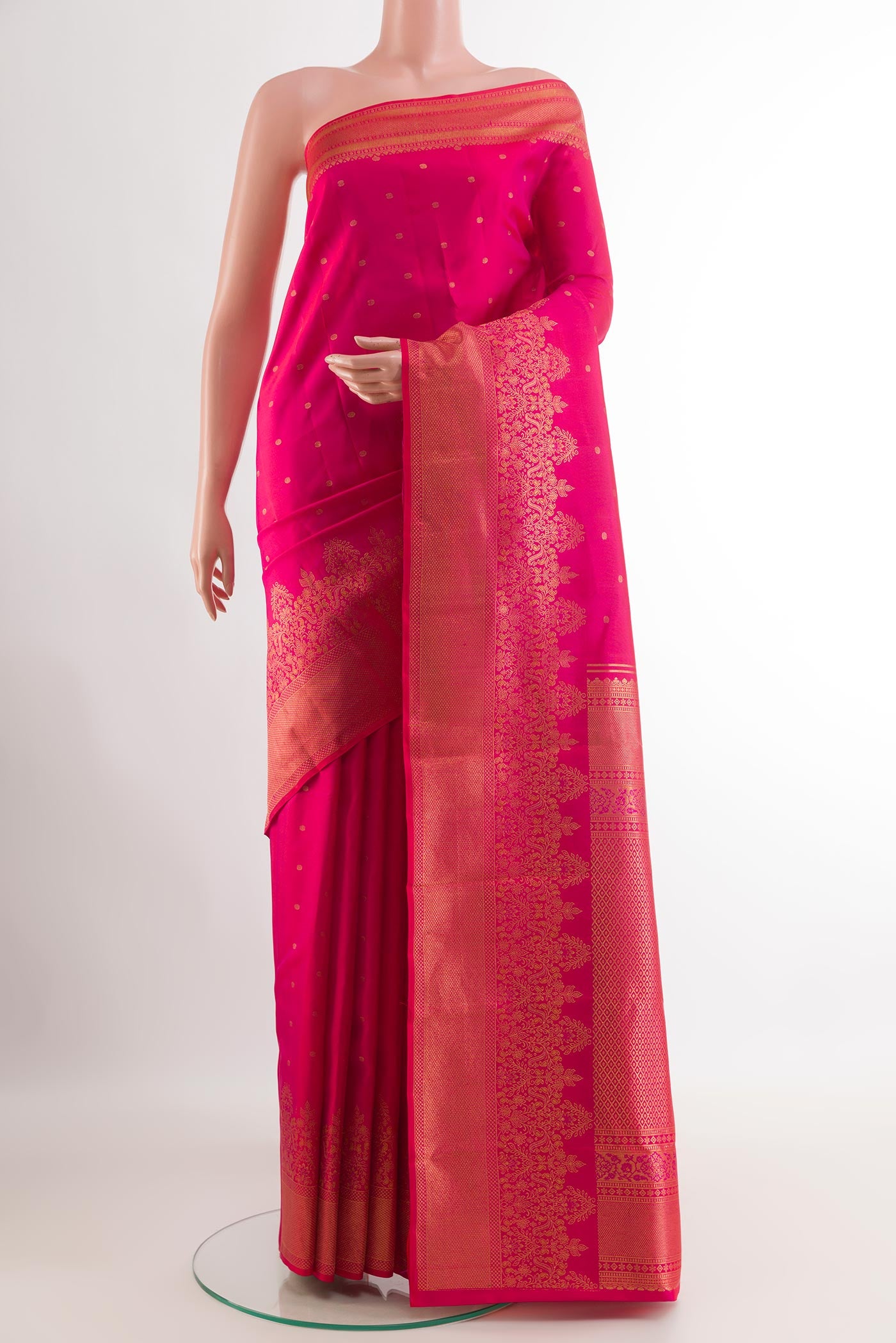 Pink Kanchipuram Silk Saree with Zari Butta on the body and Zari Border.  displayed on a mannequin