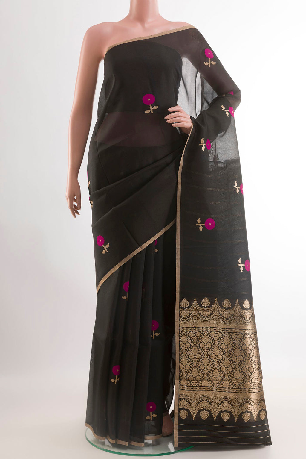 Black Organza Silk Saree with Zari Butta on the body and Zari Border.  displayed on a mannequin