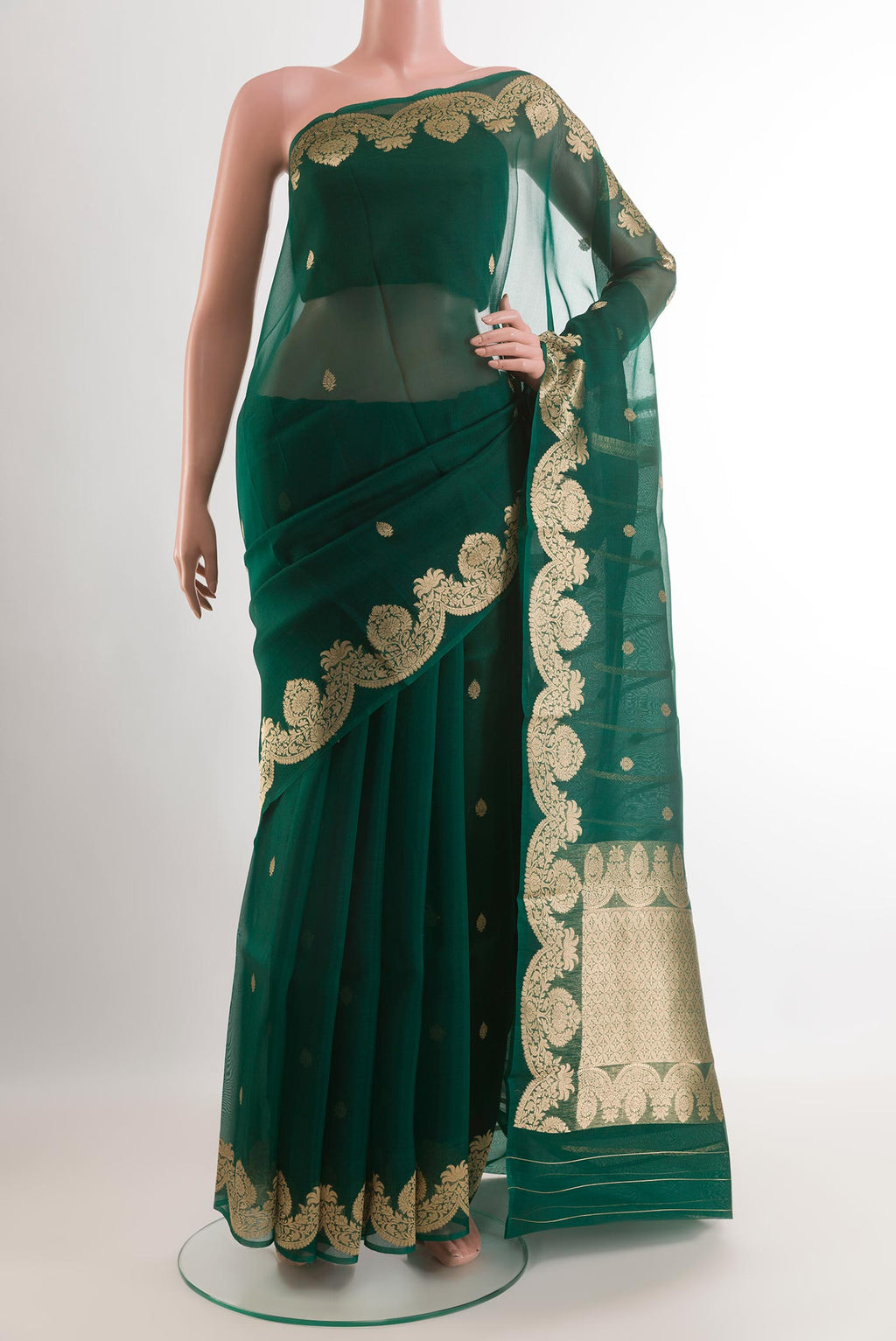 Green Organza Silk Saree with Zari Butta on the body and Zari Border.  displayed on a mannequin