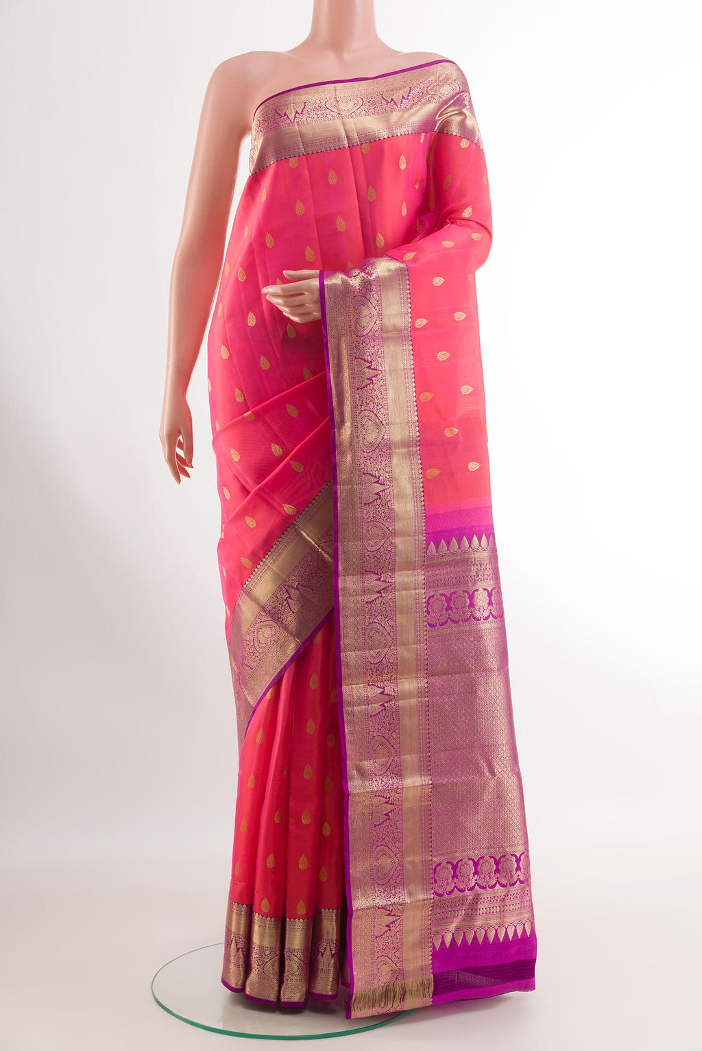 Pink Kanjivaram Silk Saree with Zari Brocade on the body and Zari Border.  displayed on a mannequin