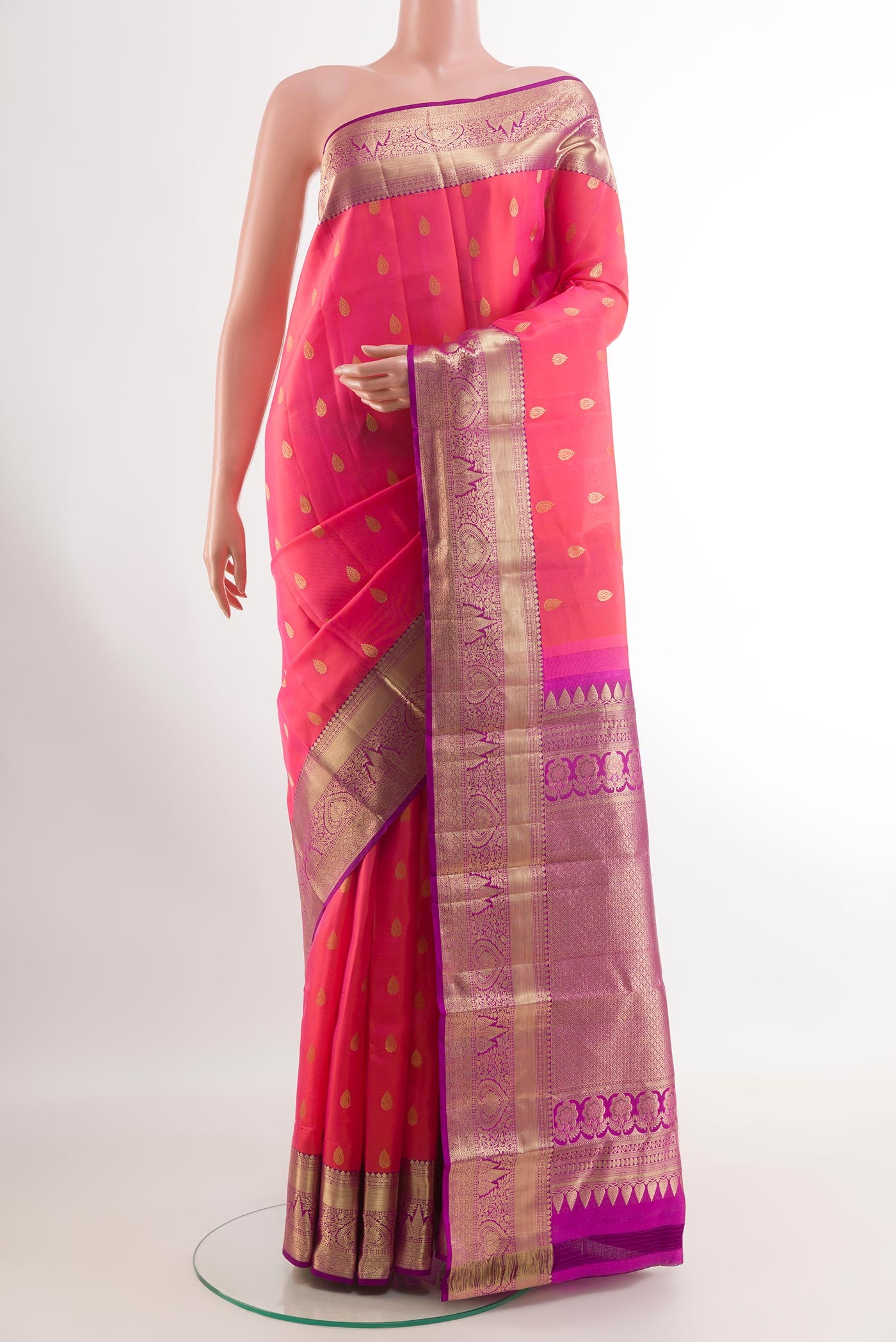 Pink Kanjivaram Silk Saree with Zari Brocade on the body and Zari Border.  displayed on a mannequin