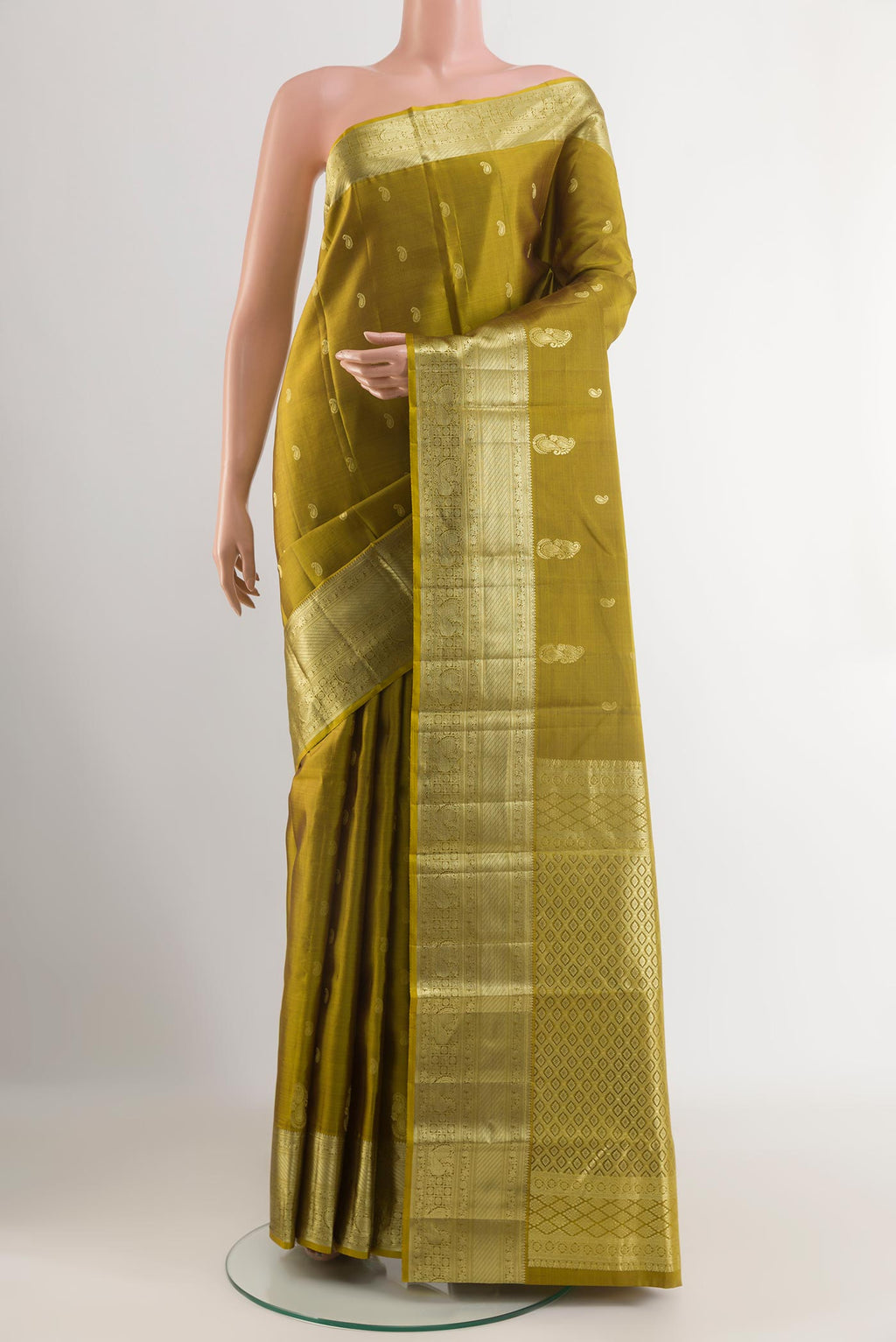 Mehandi Green Kanjivaram Silk Saree with Zari Butta on the body and Zari Border.  displayed on a mannequin