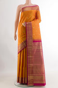Orange Kanchipuram Silk Saree with Zari Butta on the body and Zari Border.  displayed on a mannequin