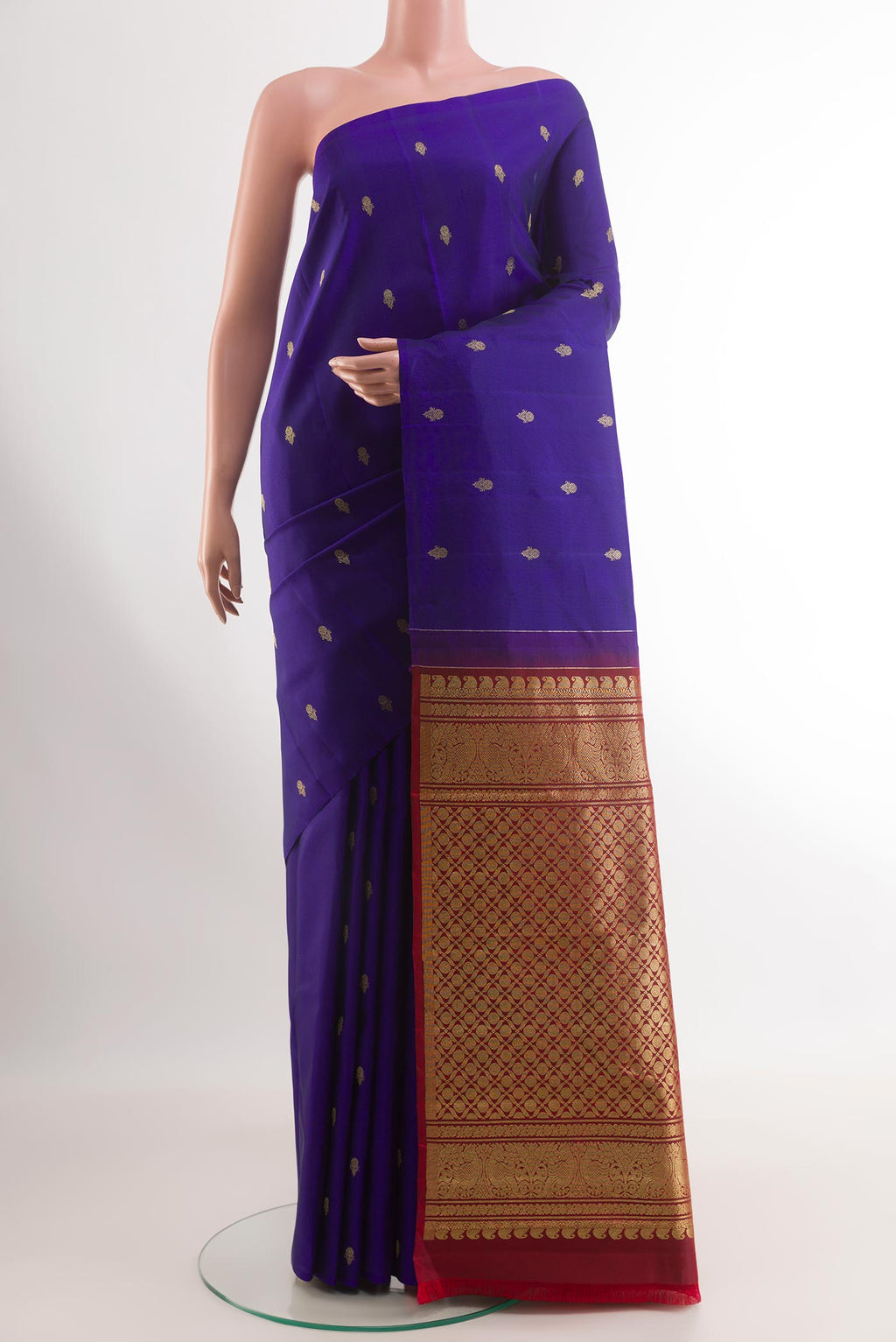 Blue Kanchipuram Silk Saree with Zari Butta on the body and Zari Border.  displayed on a mannequin