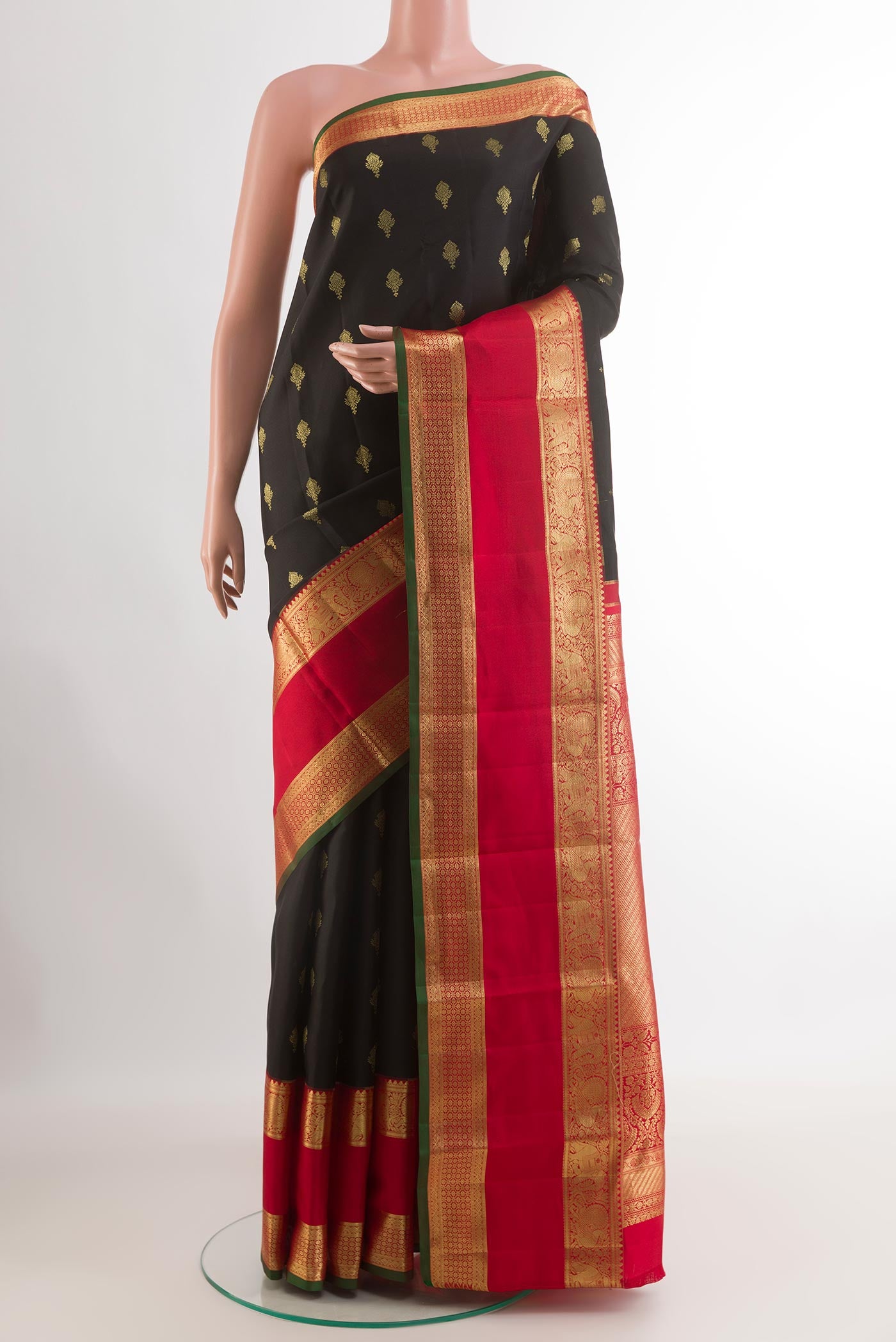 Black Kanjivaram Silk Saree with Zari Butta on the body and Zari Border.  displayed on a mannequin