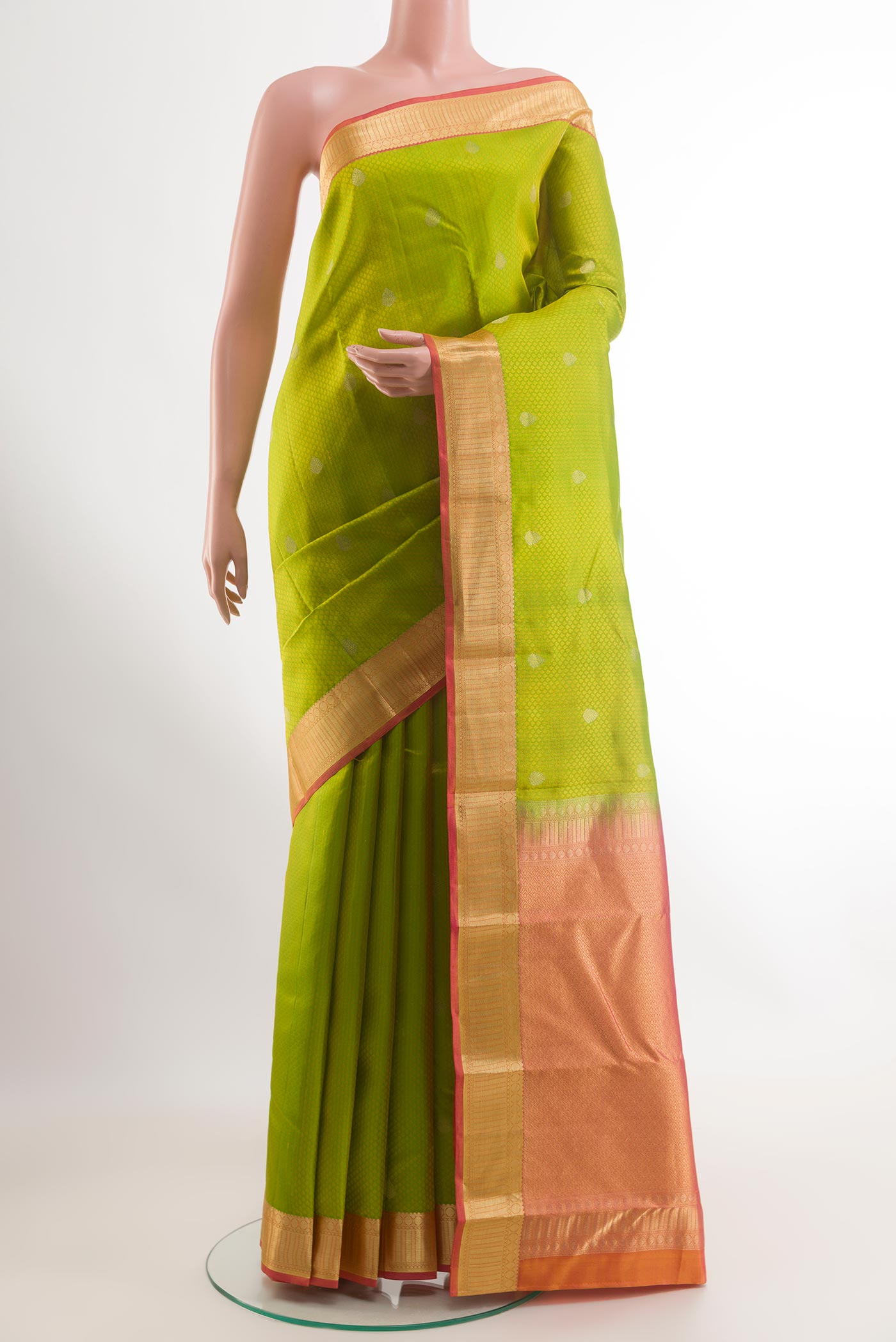 Green Kanchipuram Silk Saree with Jacquard With Zari Butta on the body and Zari Border.  displayed on a mannequin