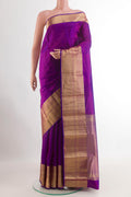 Purple Kanchipuram Silk Saree with Jacquard design on the body and Zari Border.  displayed on a mannequin