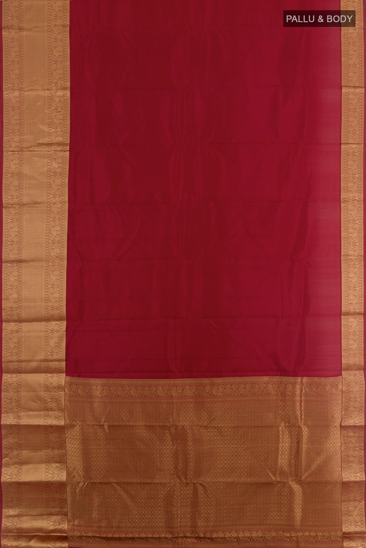 Flat view of Maroon Kanchipuram Silk Saree with Jacquard design on the body and Zari Border. 